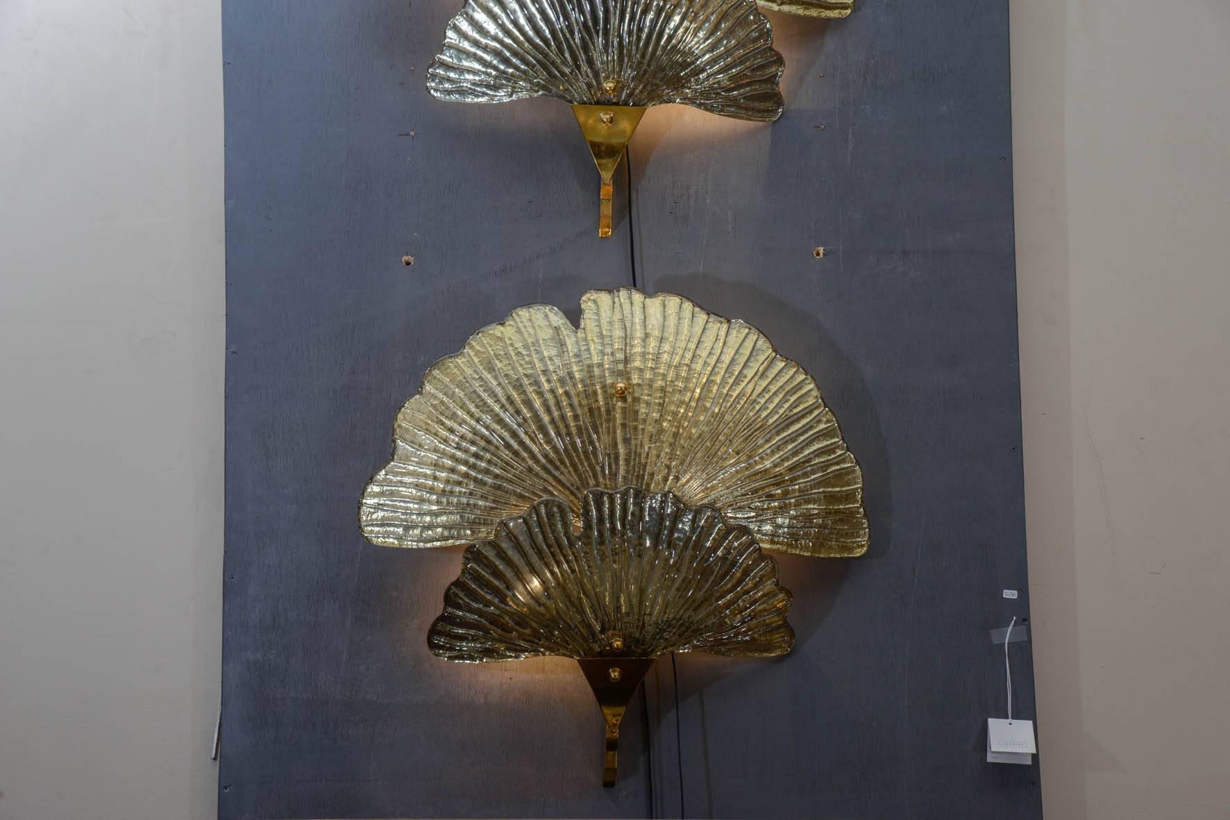 Pair of gilt and silvered Murano glass waterlily sconces, four bulbs per sconce.
Four sconces are available.
4400 euros for one pair.
