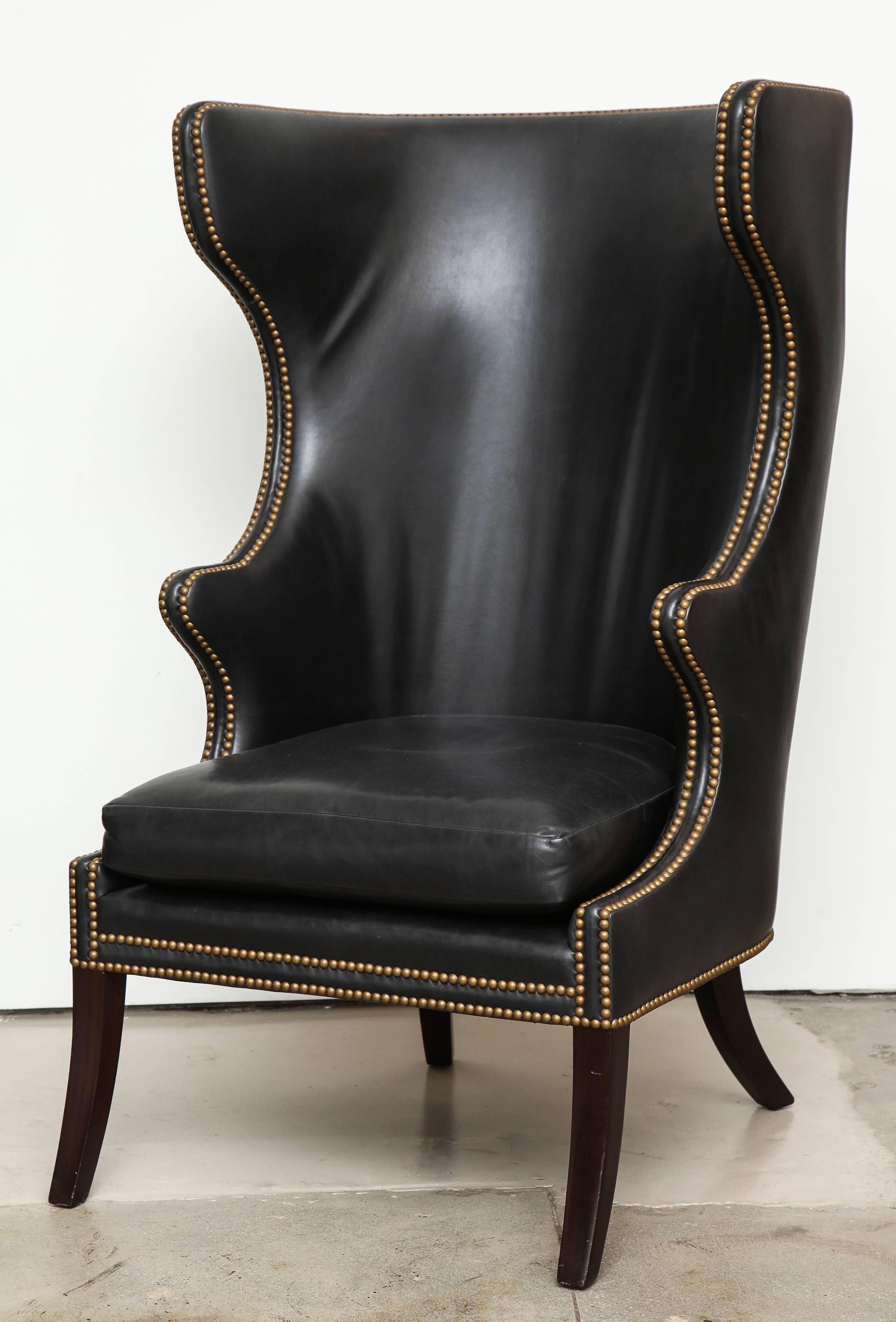 High back black leather chair from an unknown designer, circa 1980. Excellent condition, no cracking in leather.

Anonymous
Chair, circa 1980
Leather, mahogany
Measure: 49