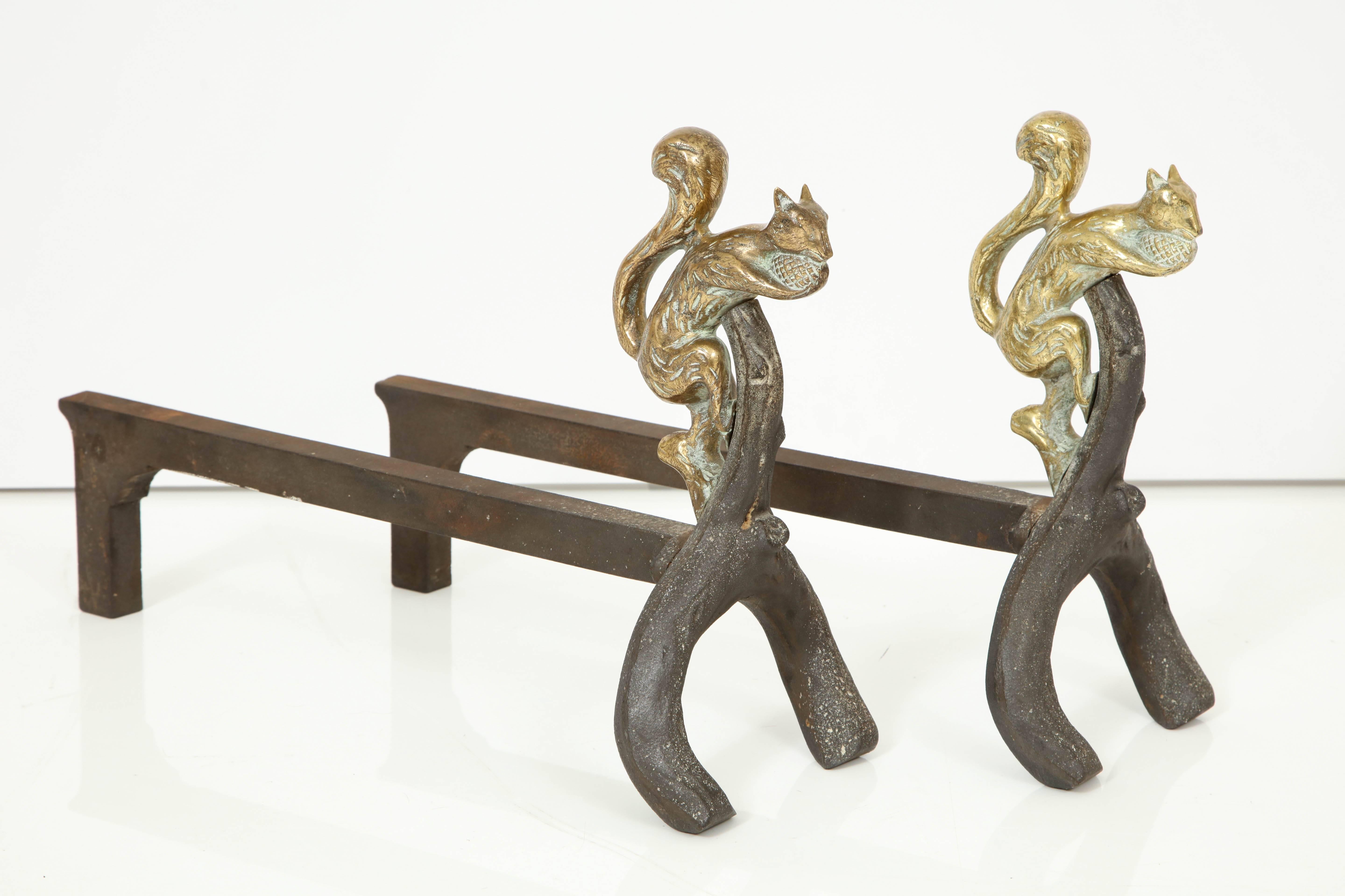 Pair of bronze and iron squirrel andirons.