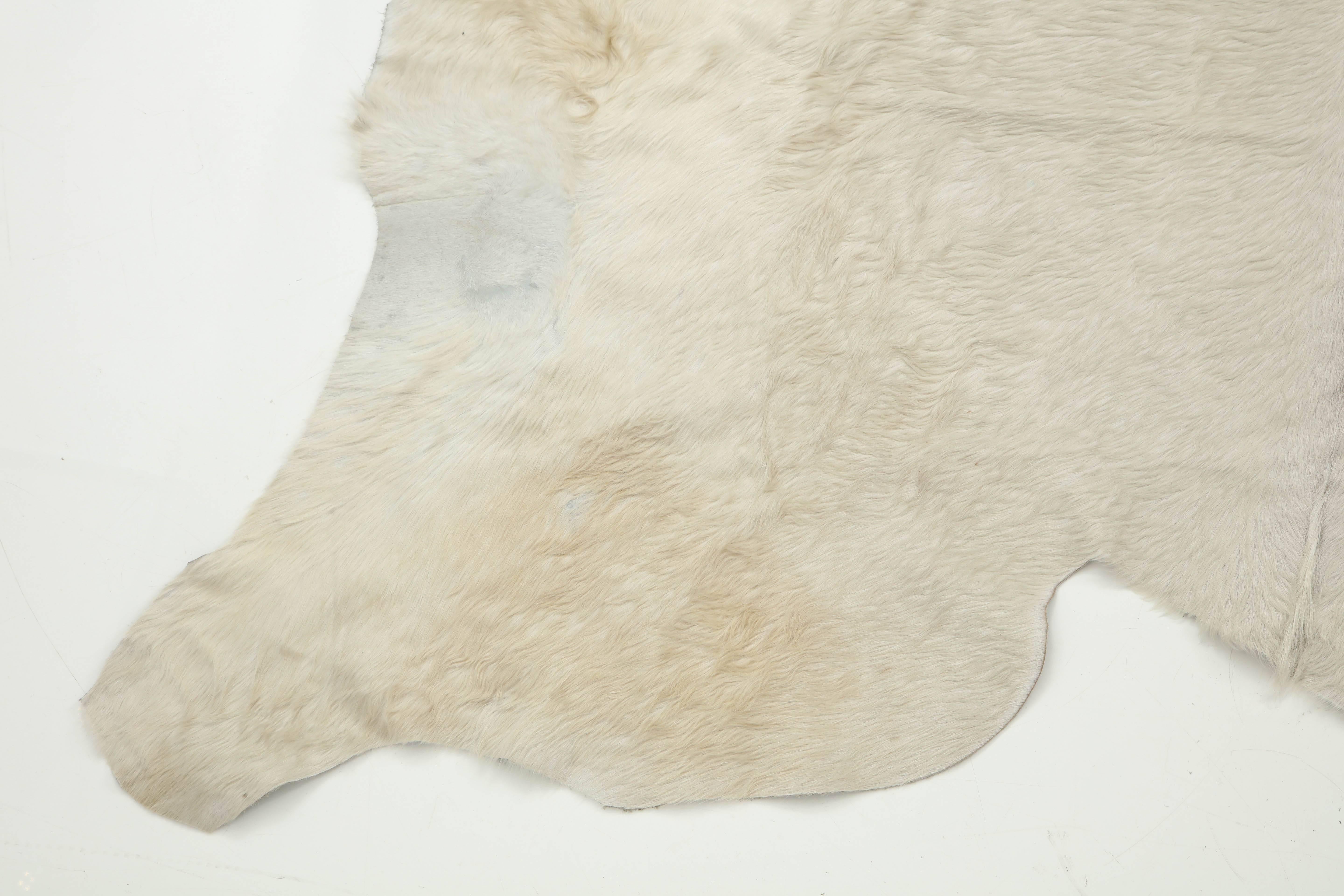 Decorative large white cow hide rug. Very durable.