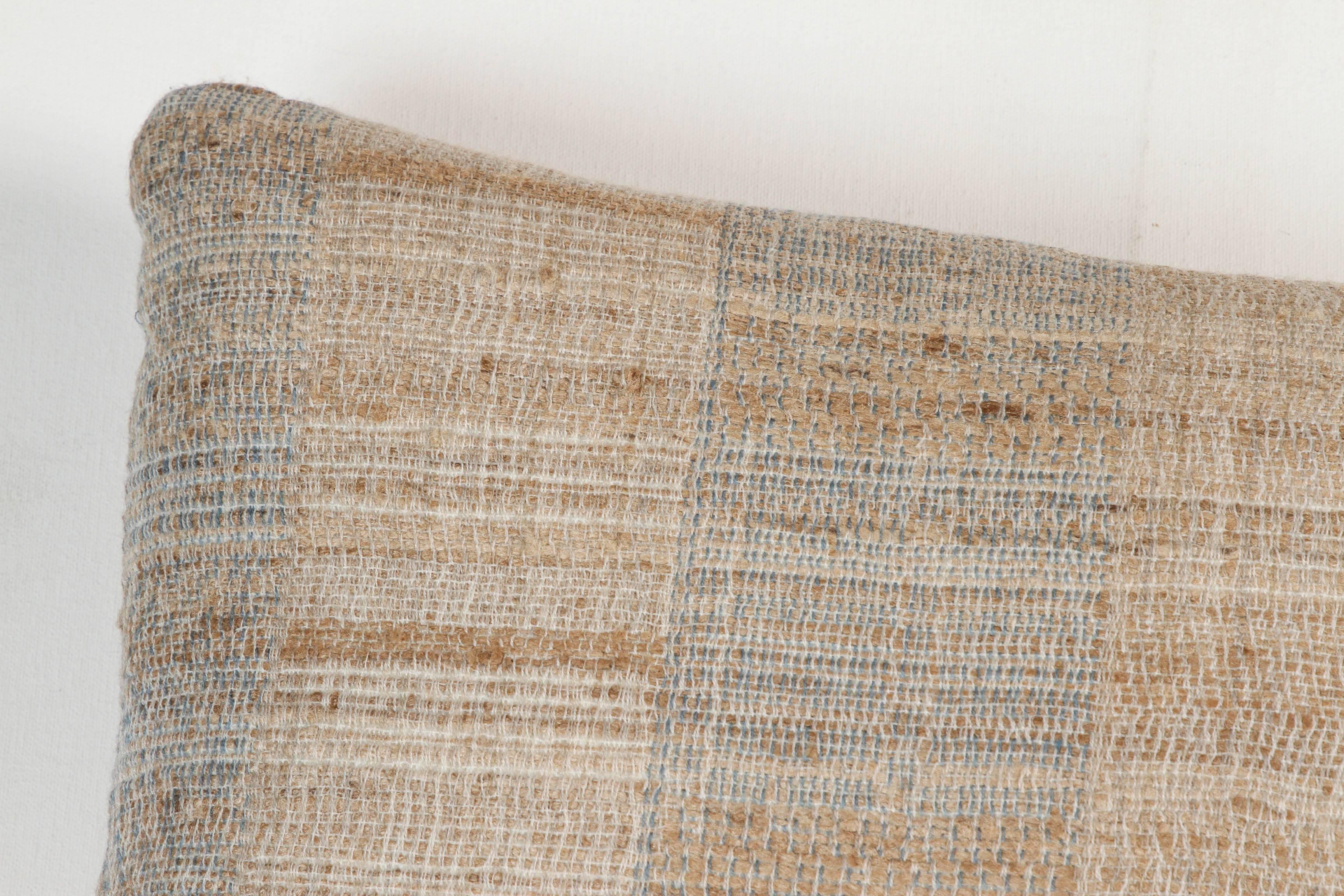 A contemporary line of cushions, pillows, throws, bedcovers, bedspreads and yardage handwoven in India on antique Jacquard looms. Handspun wool, cotton, linen, and raw silk give the textiles an appealing uneven quality.

This wool and raw tussar