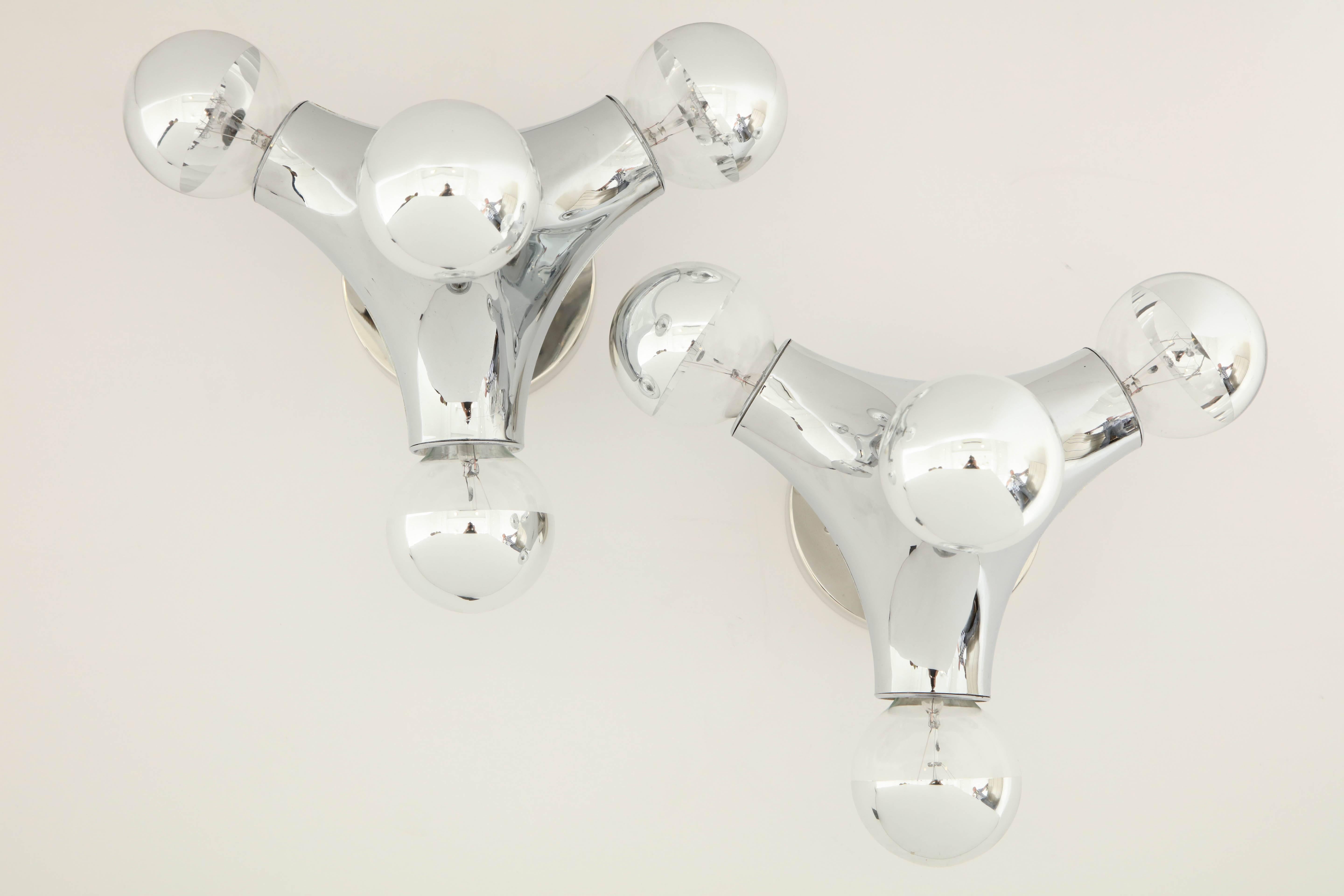Pair of 1960s German Spage Age wall or ceiling lights by Cosack
High polished PVC fixture has four-light sources that have been newly rewired for the US and the fixtures come complete with chrome capped bulbs.