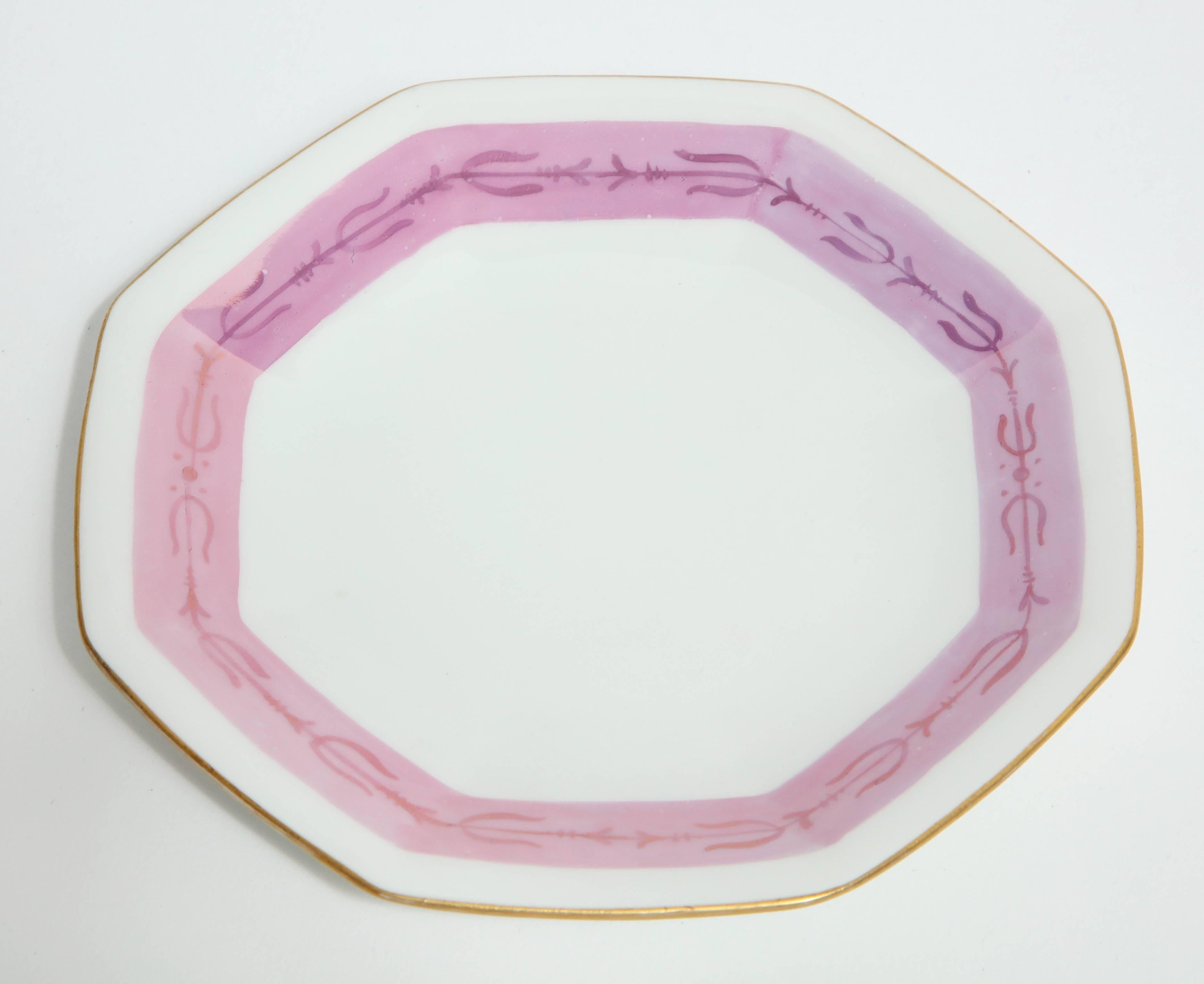 Set of six octagonal shaped dessert or bread plates in ivory porcelain with fantastic French Pompadour pink bands and gold trimmed edges. Marked on underside Limoges.