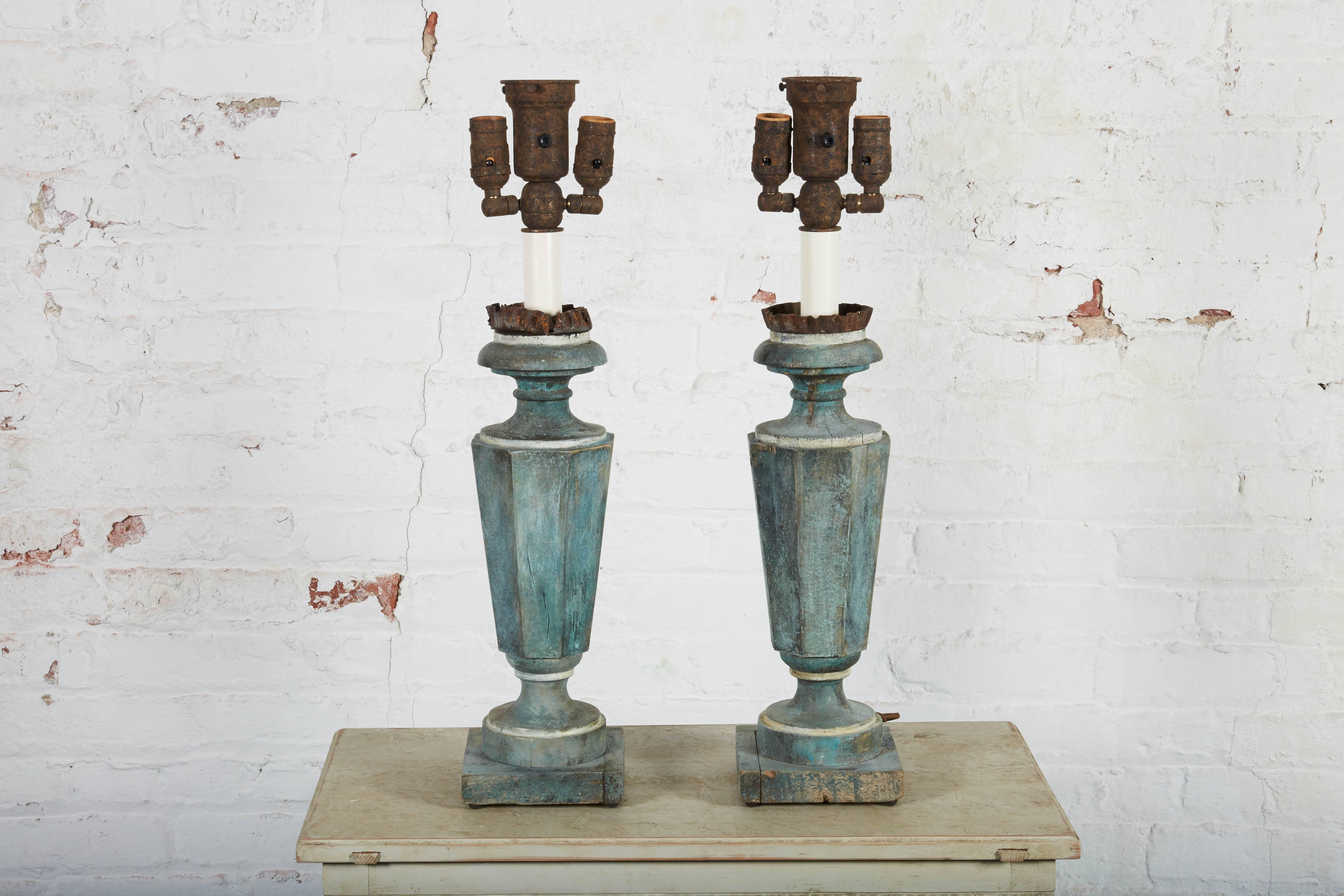 Each an antique blue-painted wood pricket Stand converted into a three-light lamps.