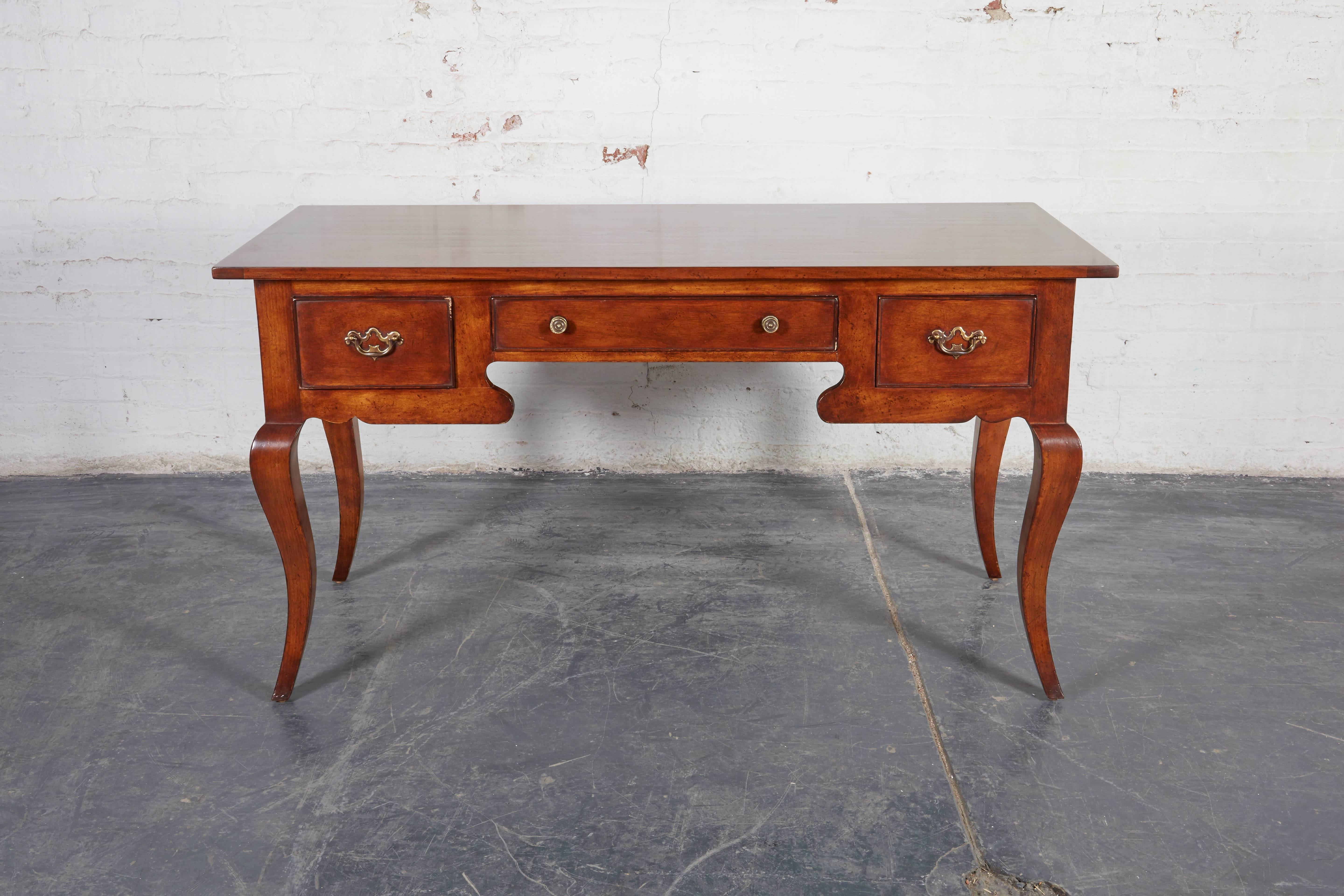 Fitted with three drawers and raised on cabriole legs. Antiqued and waxed. Note piece not finished on the back and it meant to be against a wall.