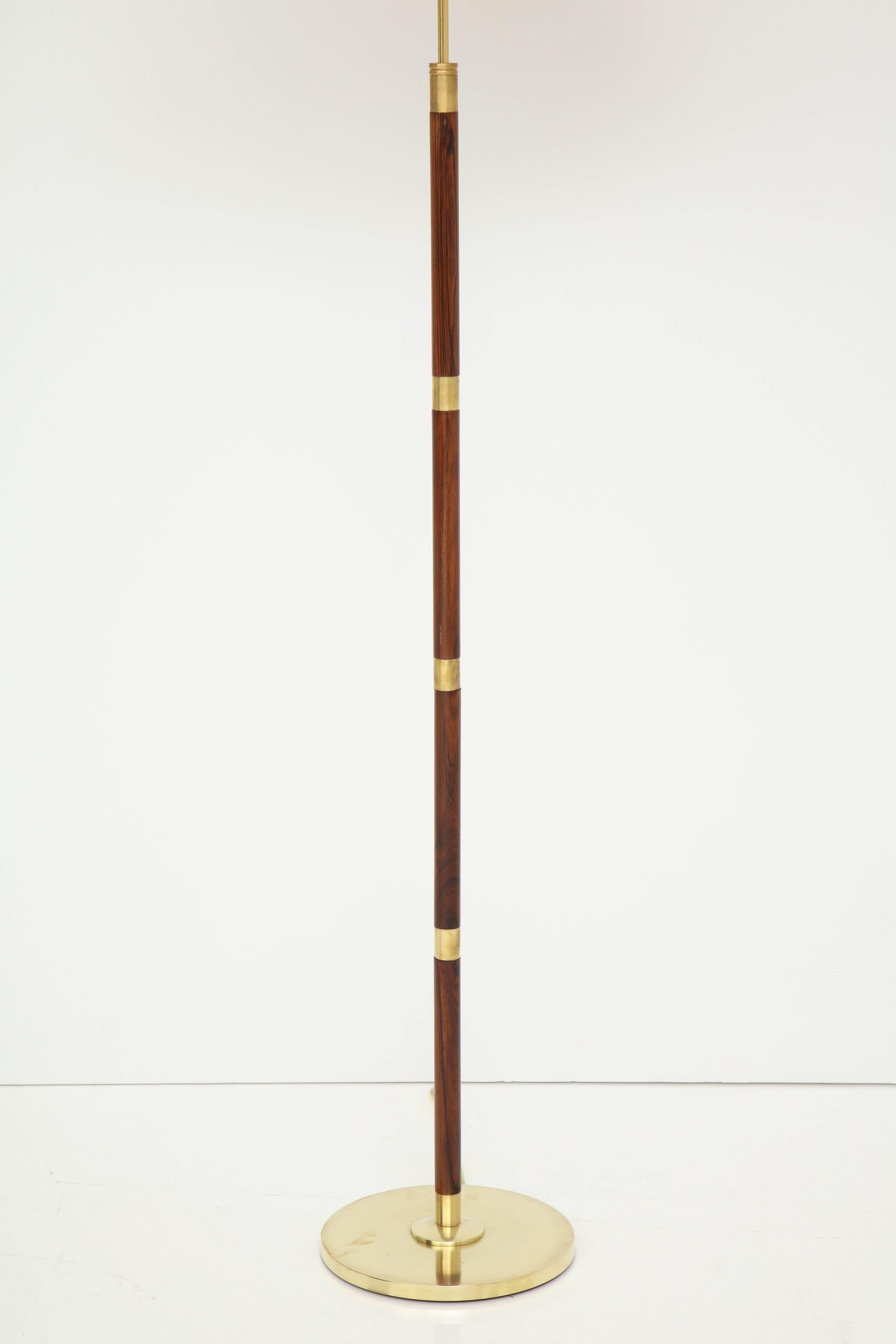 A Danish brass and rosewood floor lamp by Fog & Mørup, circa 1950s. Adjustable height and re-wired for the US.