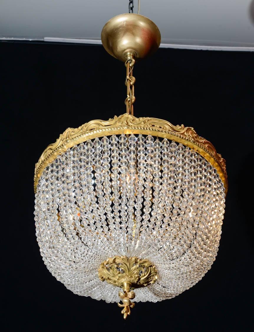 Corbeille style chandelier, crystals, gold gilt bronze, from the period of Napoleon III, 19th century.
 