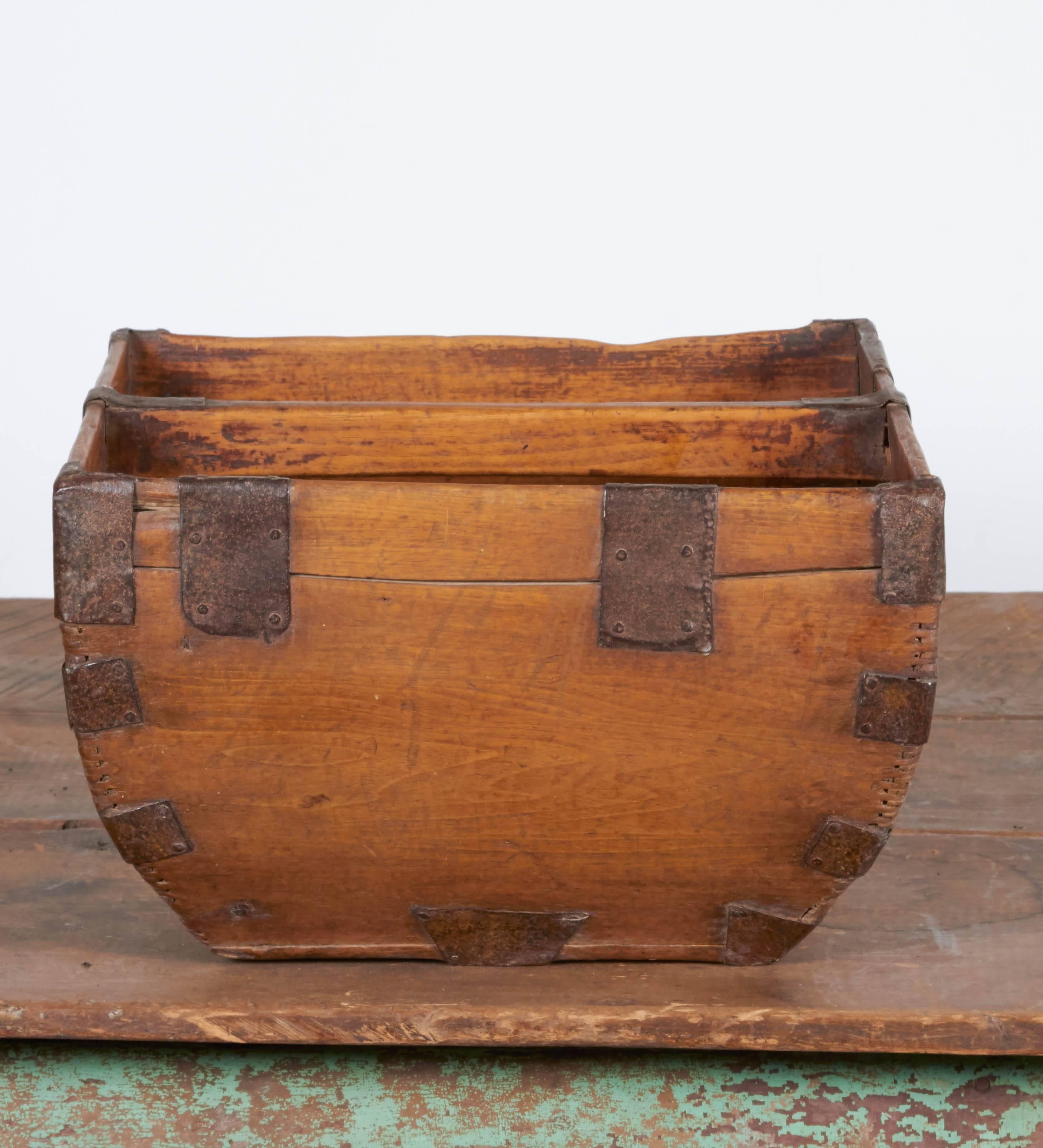 A rustic antique Chinese rice measure basket with beautiful patina and original metal hardware. Ideal for mail, magazines, or in the entry way for flip flops or dog leashes and toys. From Shandong Province.
B446.