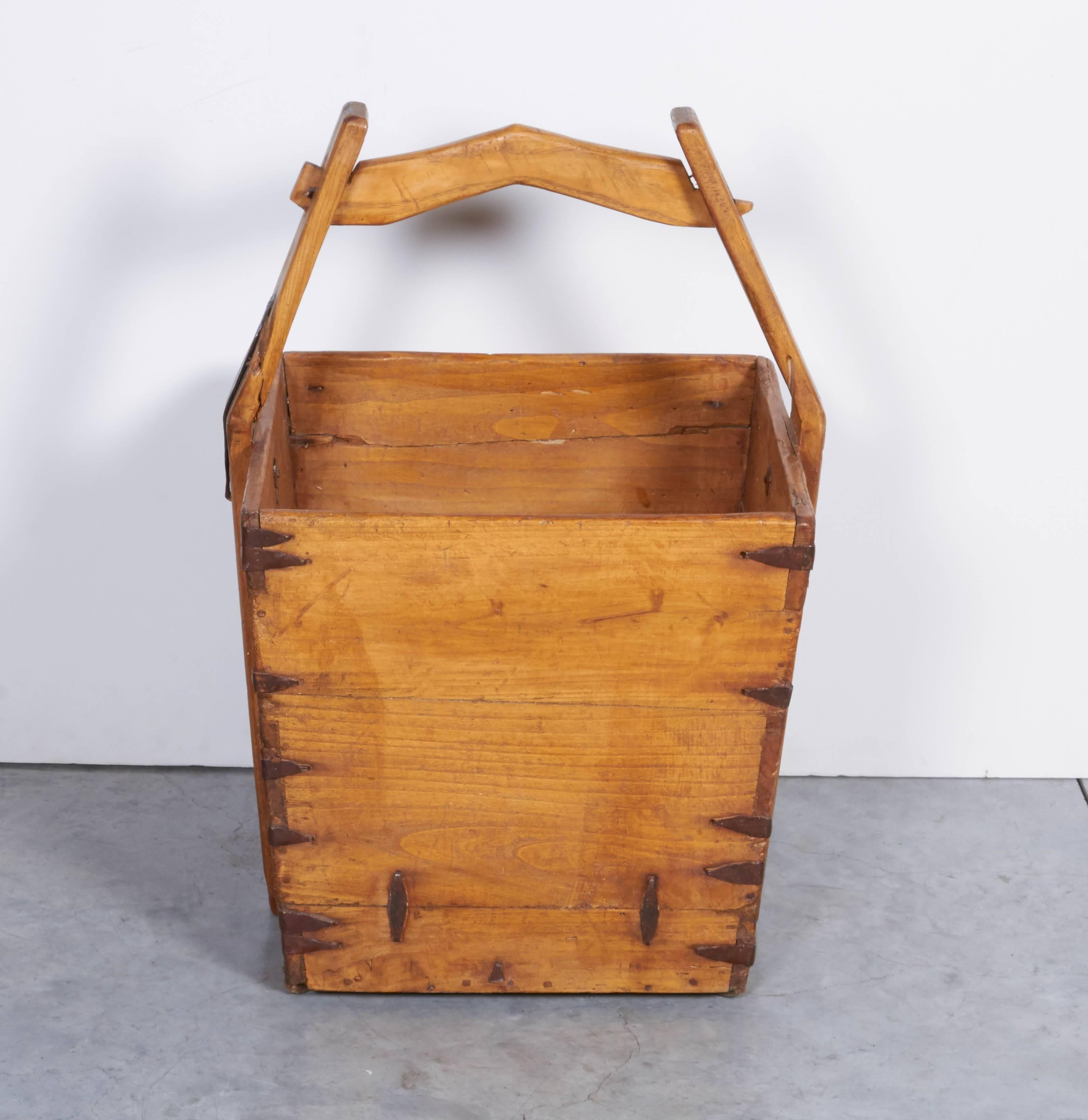 A classically shaped antique Chinese water bucket with original iron fittings. An historical piece with many practical uses including, firewood storage, magazine or book display, or rolled up towels in a beach house. From Shandong Province.
B395.
