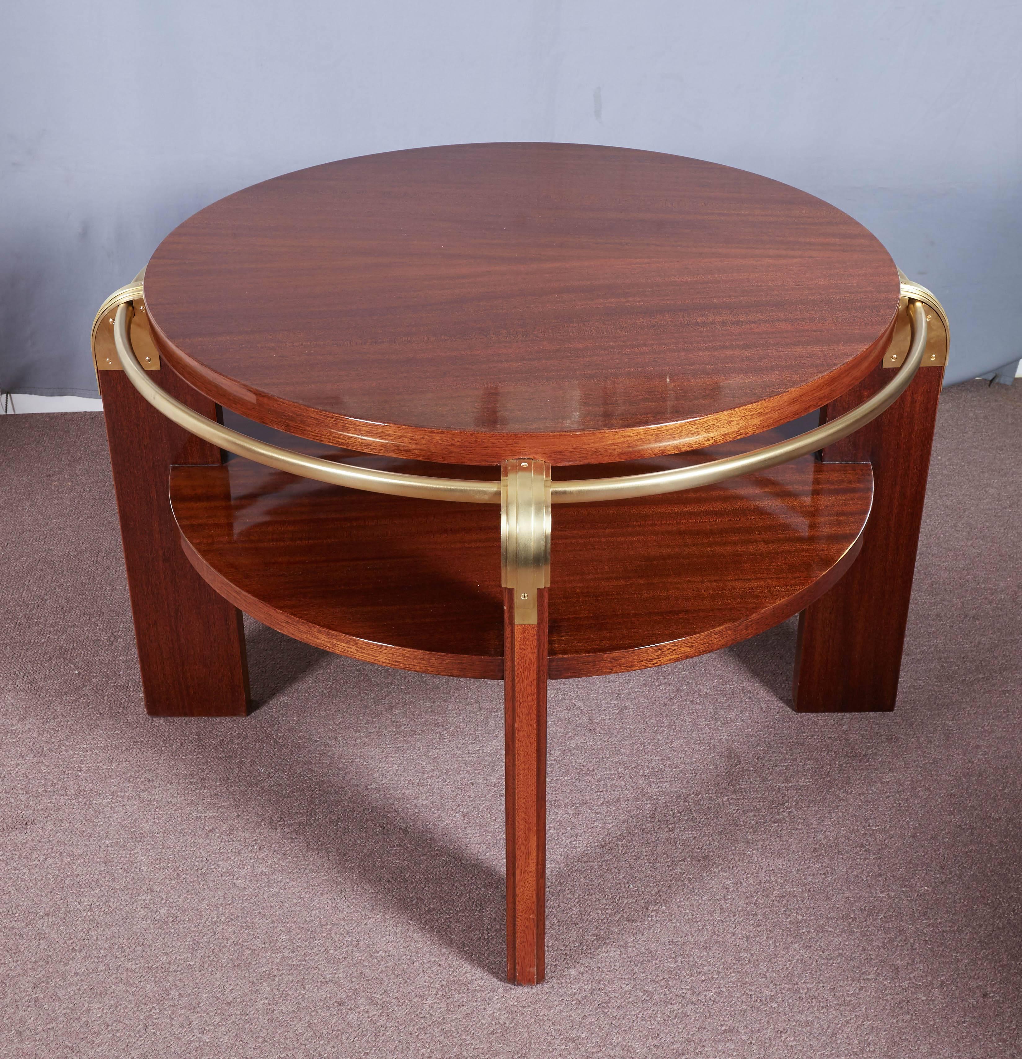 Pair of fabulous French Art Deco modernist tables in ribbon stripe mahogany with tubular brass surround and mounts; 
attributed to: Louis Sognot 1892- 1970.
 Two-tier form with four slab legs, beautifully machined radius corner caps in a stepped