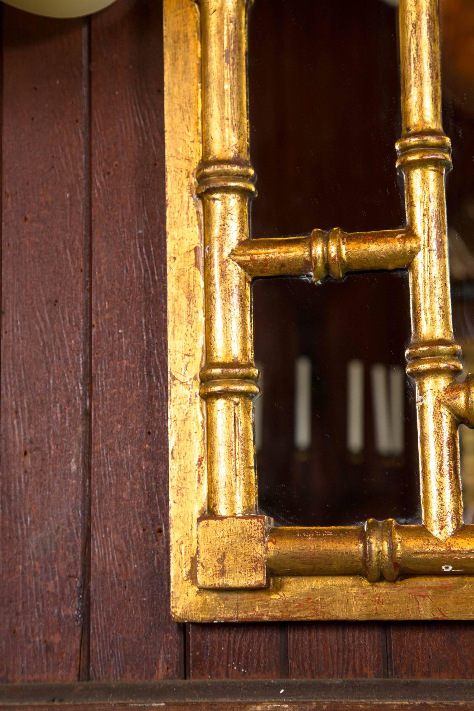 Chinese Chippendale style carved wood faux bamboo and gilt mirror with Greek Key design.