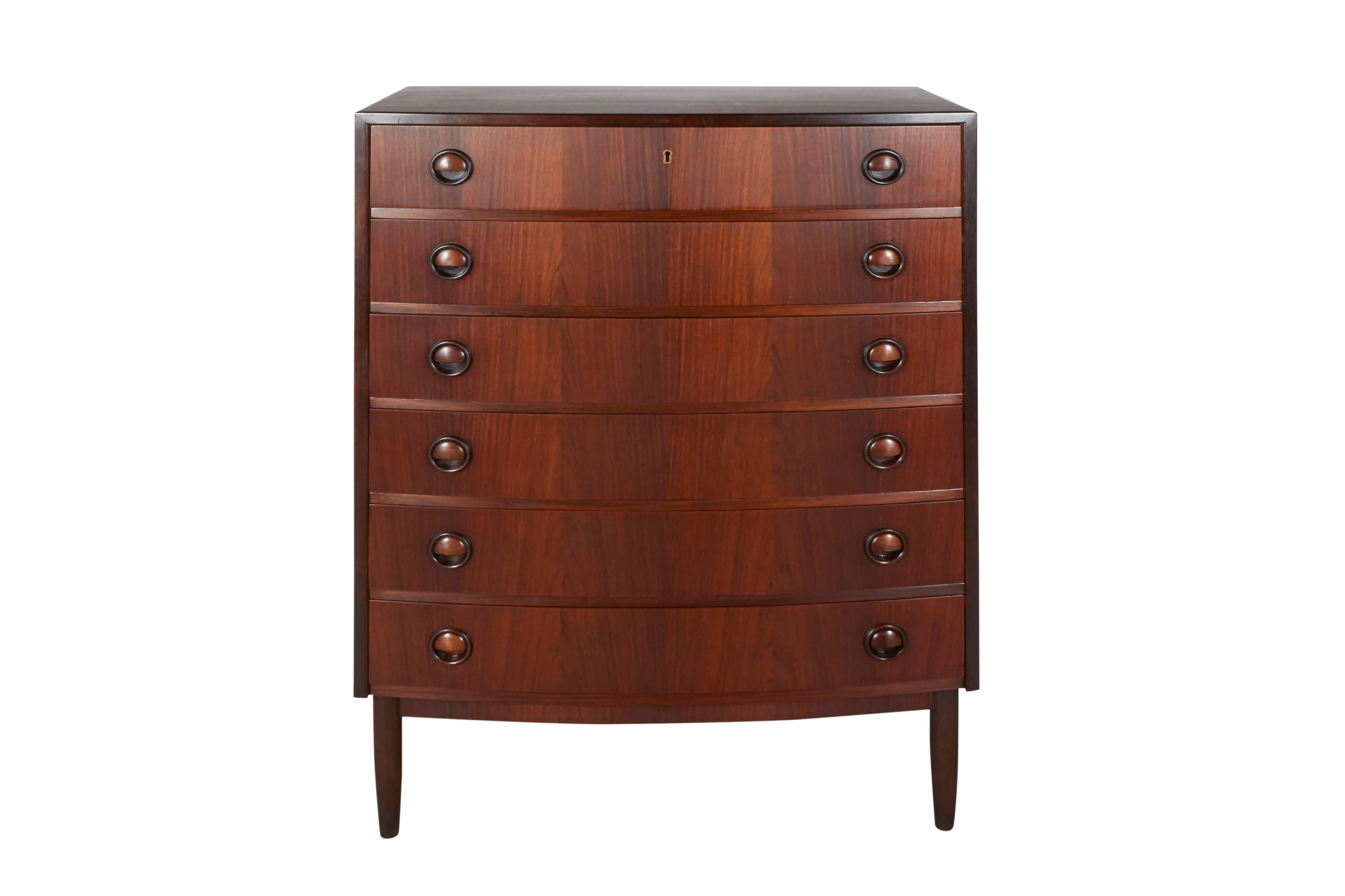 Vintage 1960s Danish Rosewood Dresser

This mid century chest of drawers is in excellent condition. 6 wide drawers makes it great for lots of storage. A lovely bedroom piece or try this piece in a hallway as linen storage, also beautiful in a living