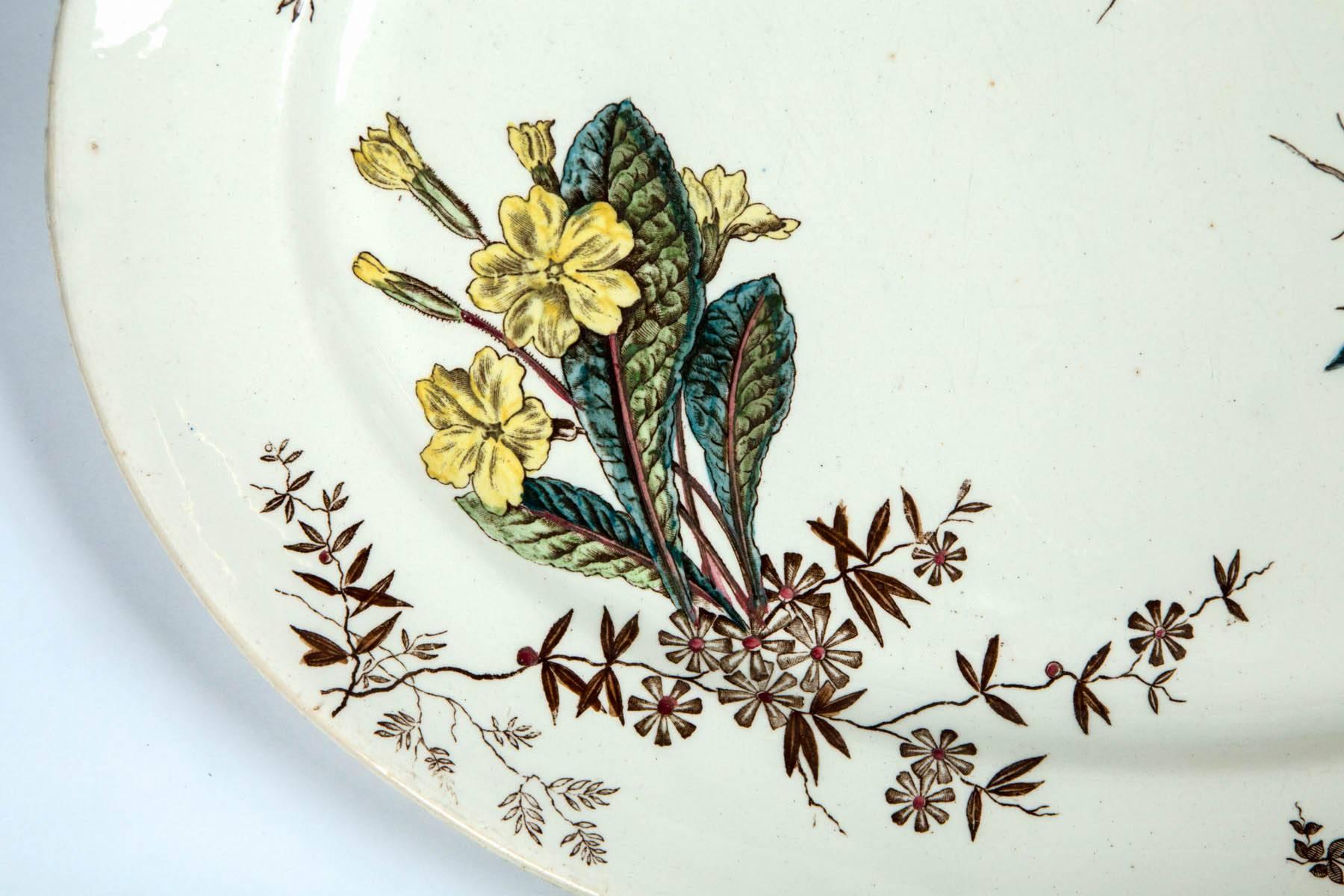Antique ceramic serving platter, early 19th century. Delicate floral sprays in blues, yellows and greens, with brown foliate.