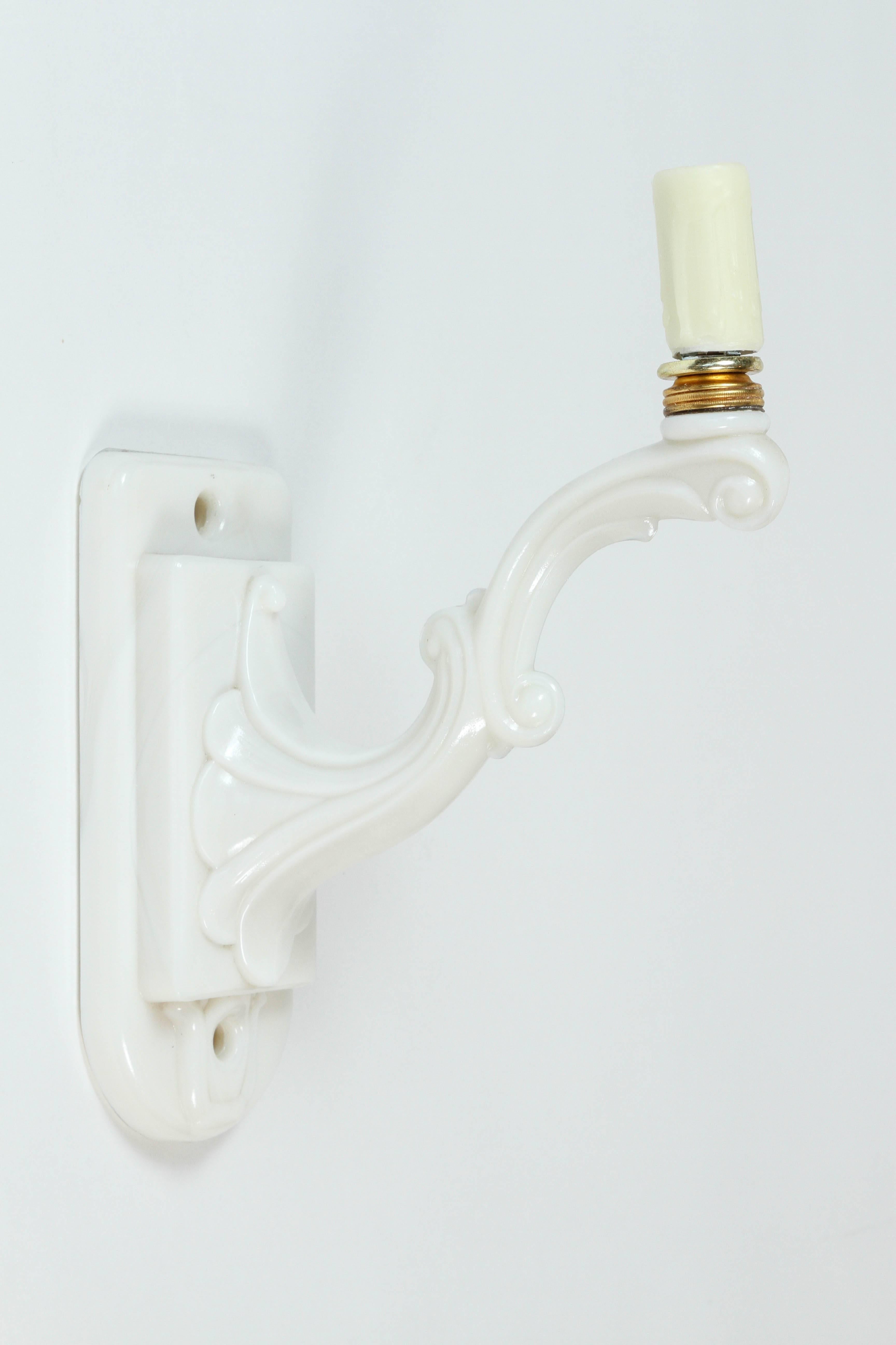 Vintage milk glass single light sconce with all new wiring and wax candle sleeve.