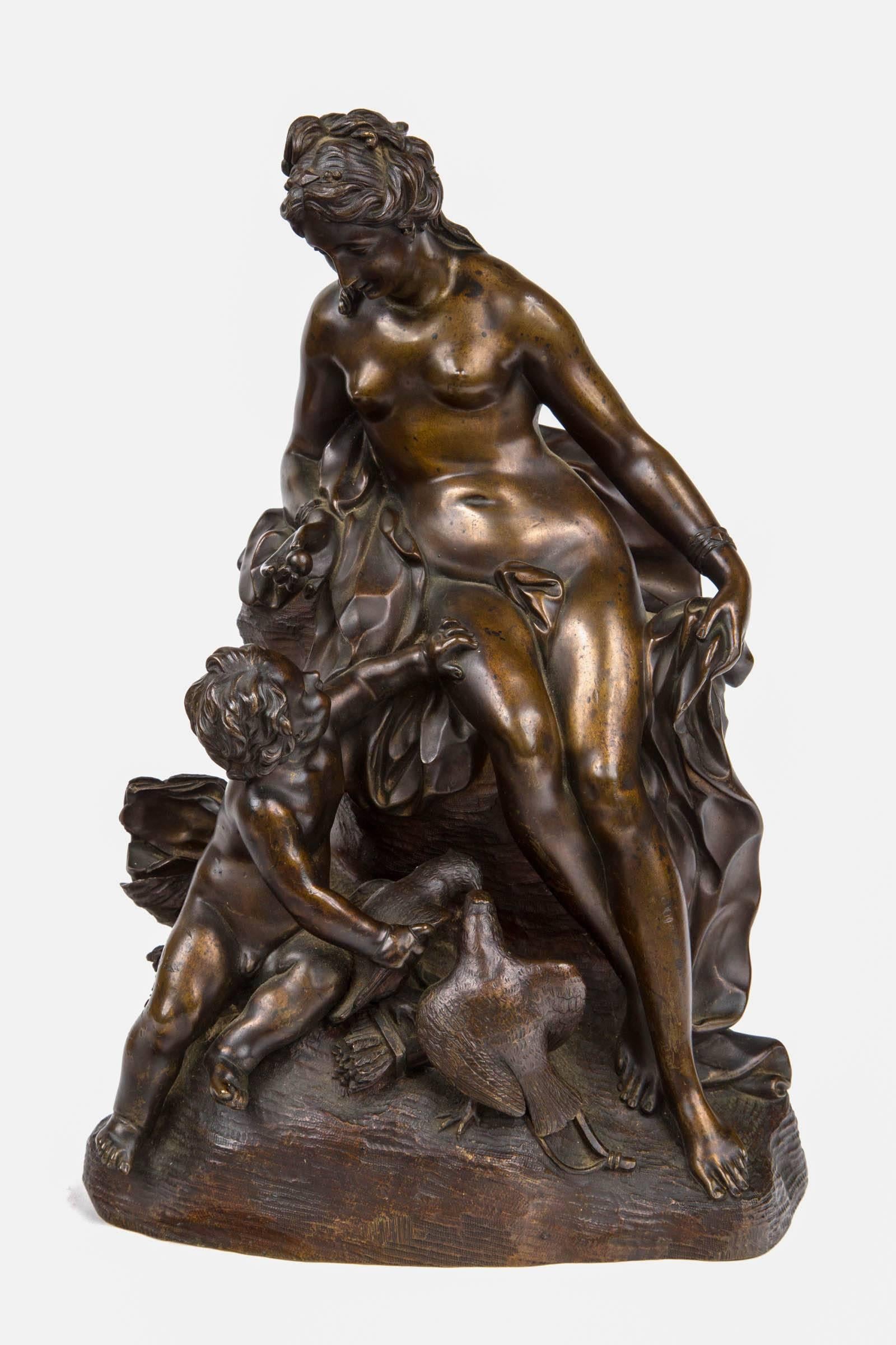A bronze group of Venus educating cupid
Circle of Corneille van Cleve (1646-1732), French, first half of the 18th century
Depicting Venus seated on a rock looking over the infant Cupid who reaches up to his mother with one hand and takes hold of
