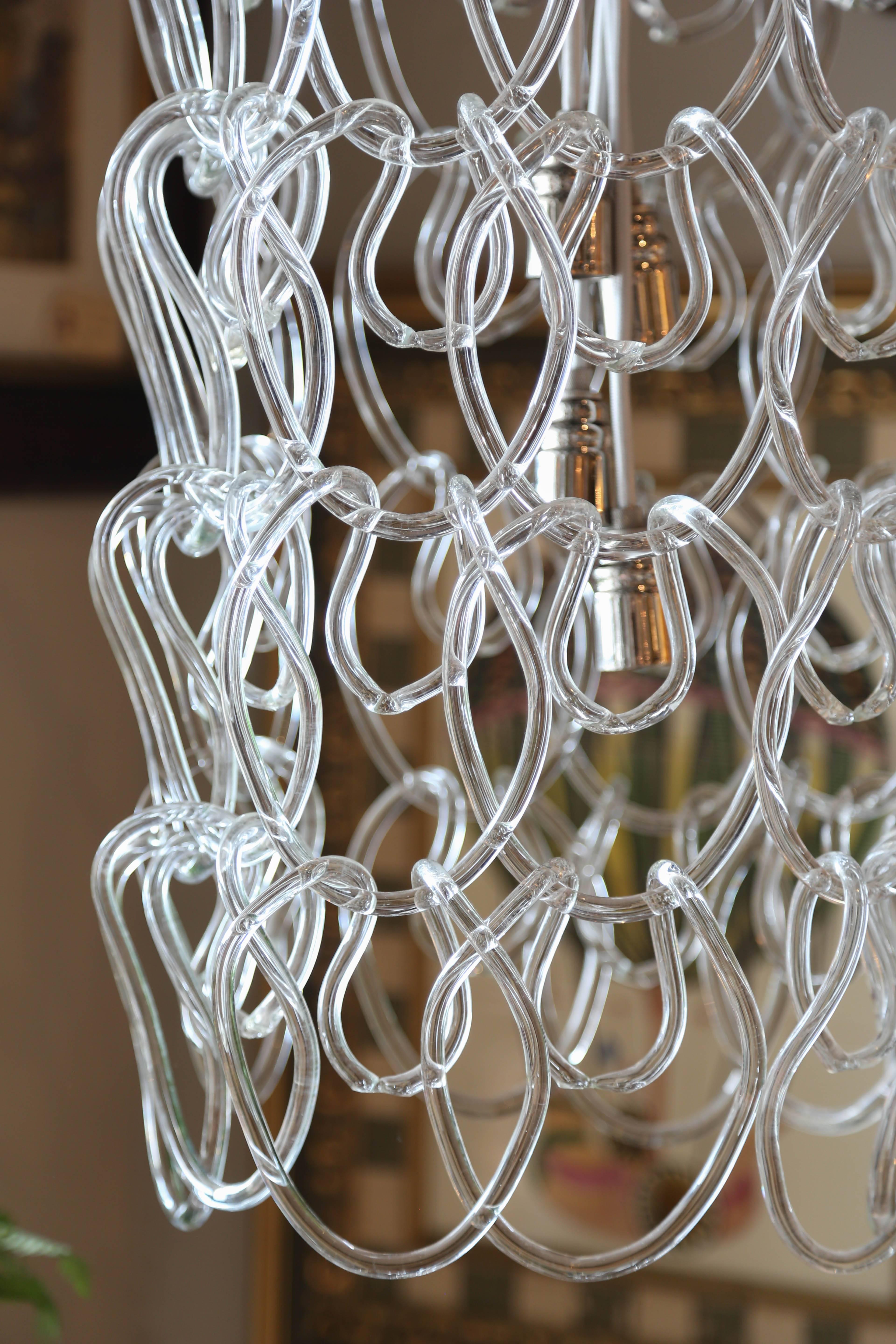 Striking six-tier Italian Murano interlocking chain link glass light fixture.