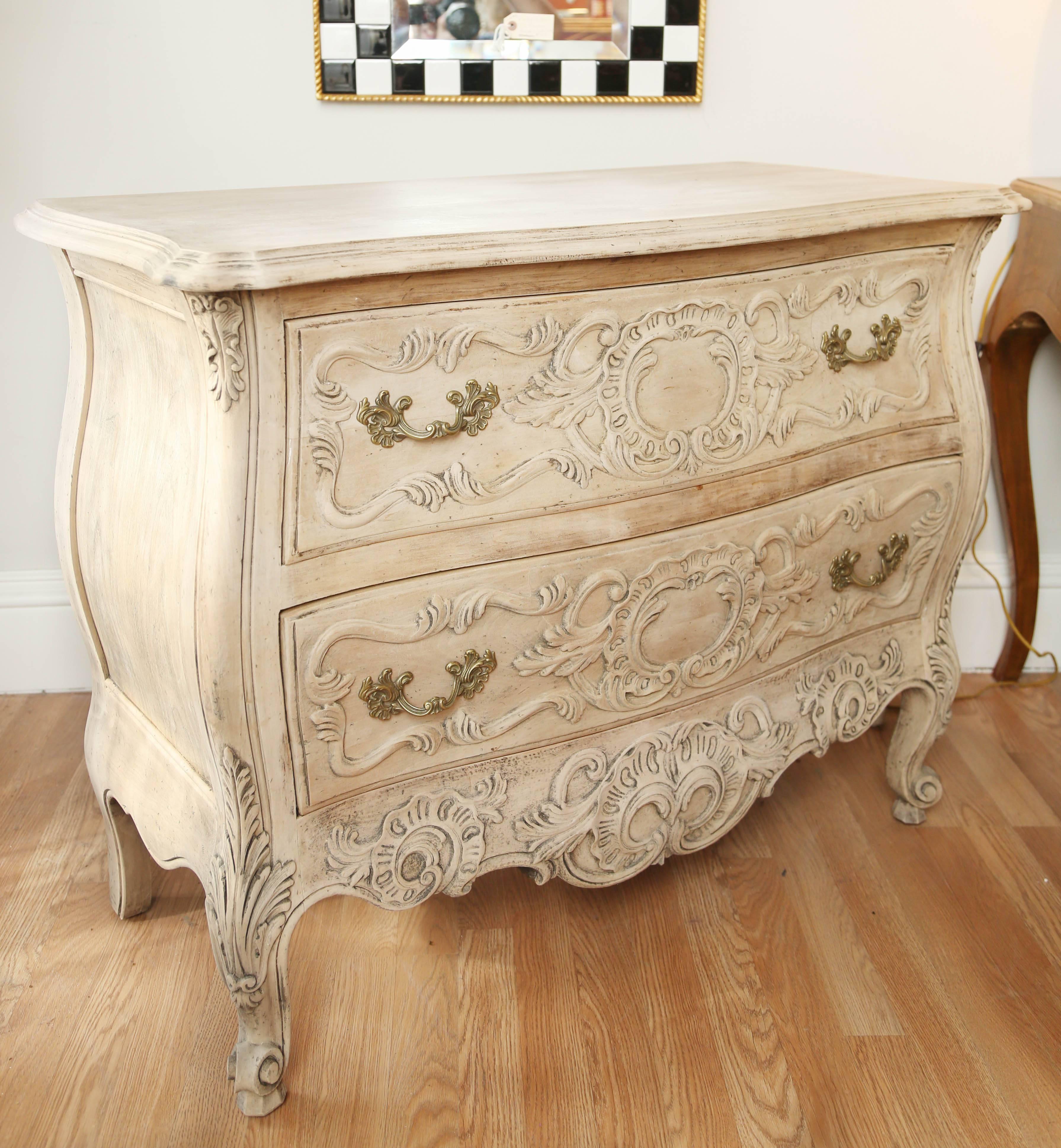 Beautifully carved and detailed French style commode with a stripped and bleached natural finish.