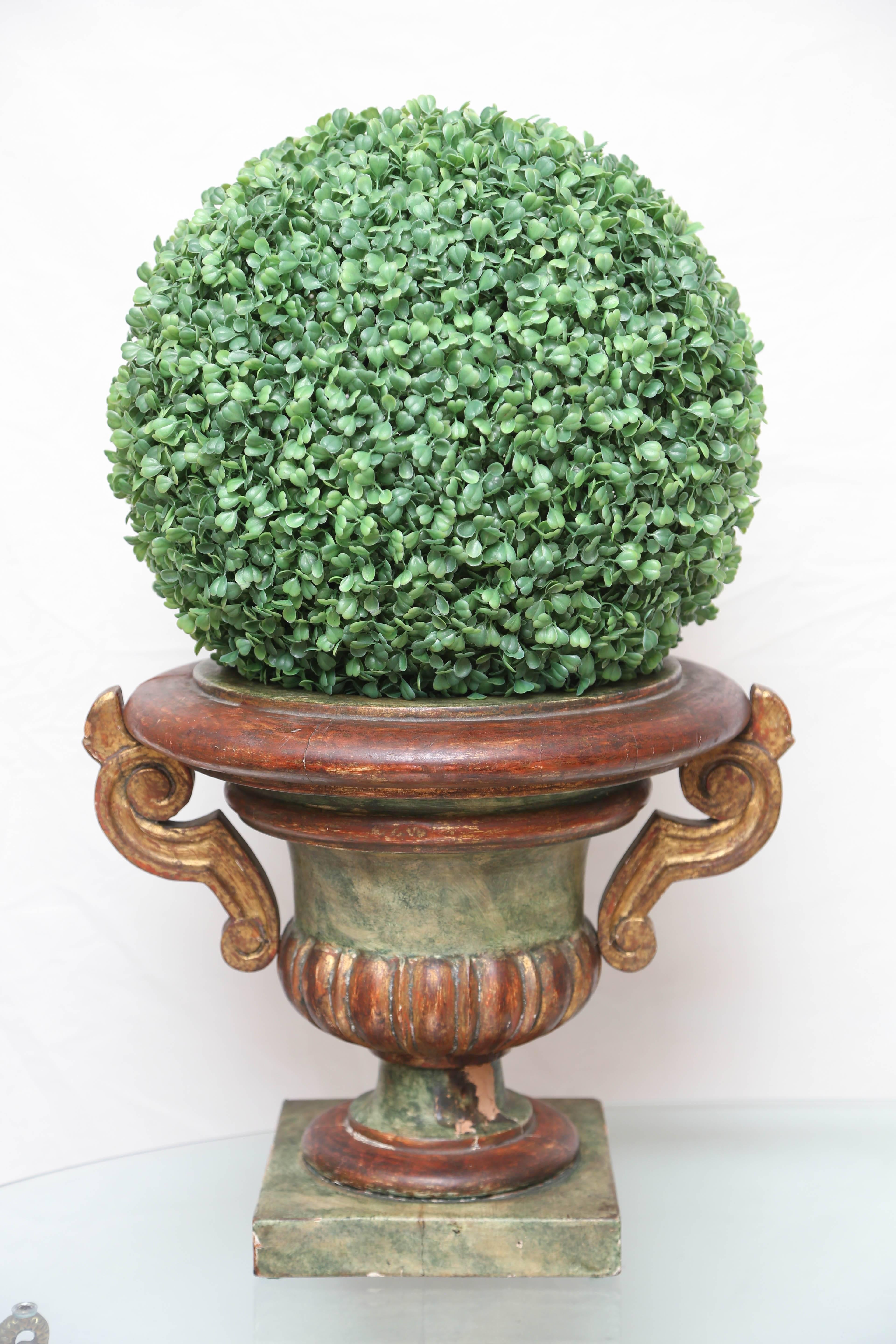 Large carved wood urn planter with original painted finish.