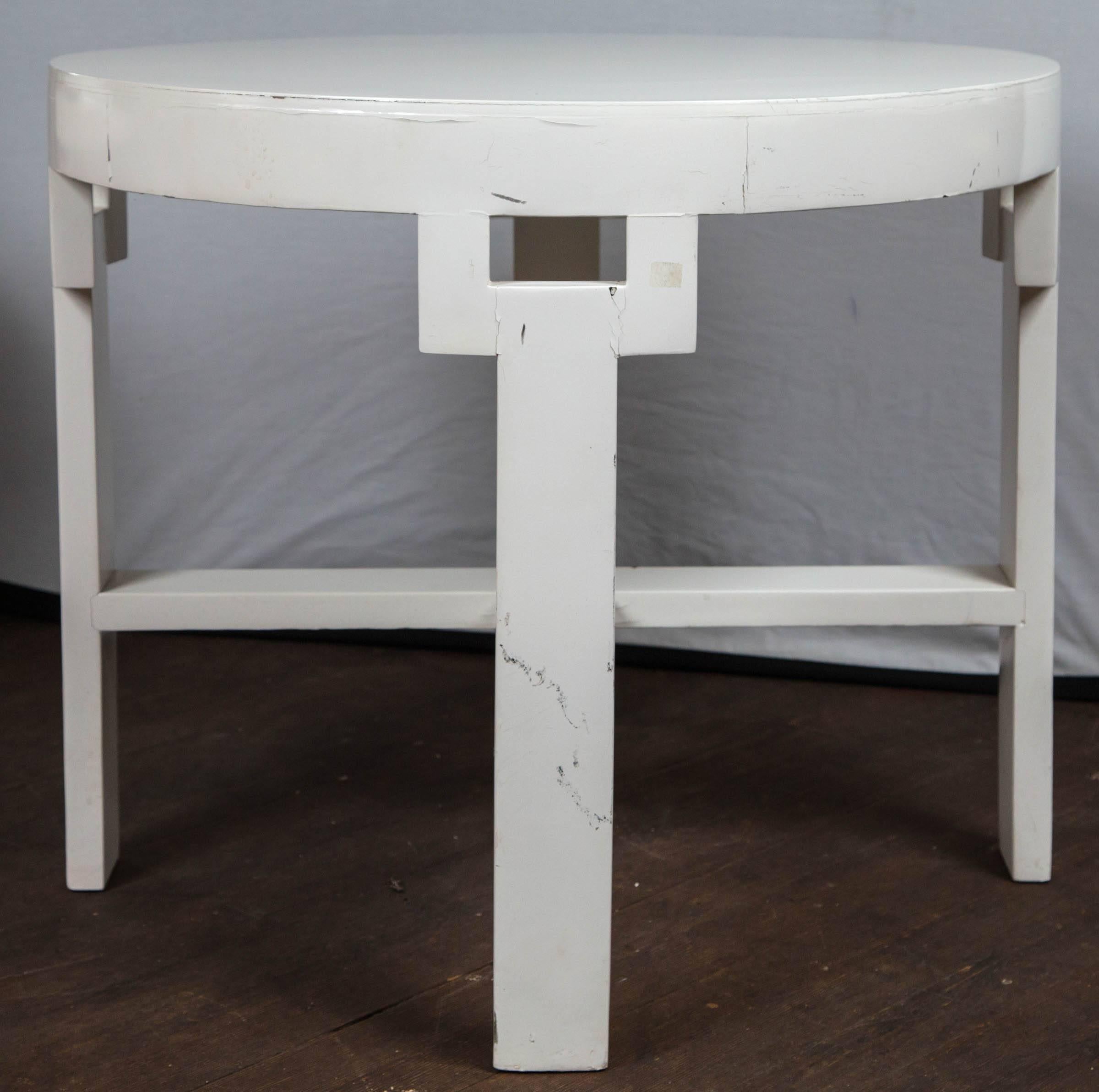 An original table from the 1948 Dorothy Draper designed Greenbrier Resort. Round table with four legs and four curved cutout rectangles details.
 