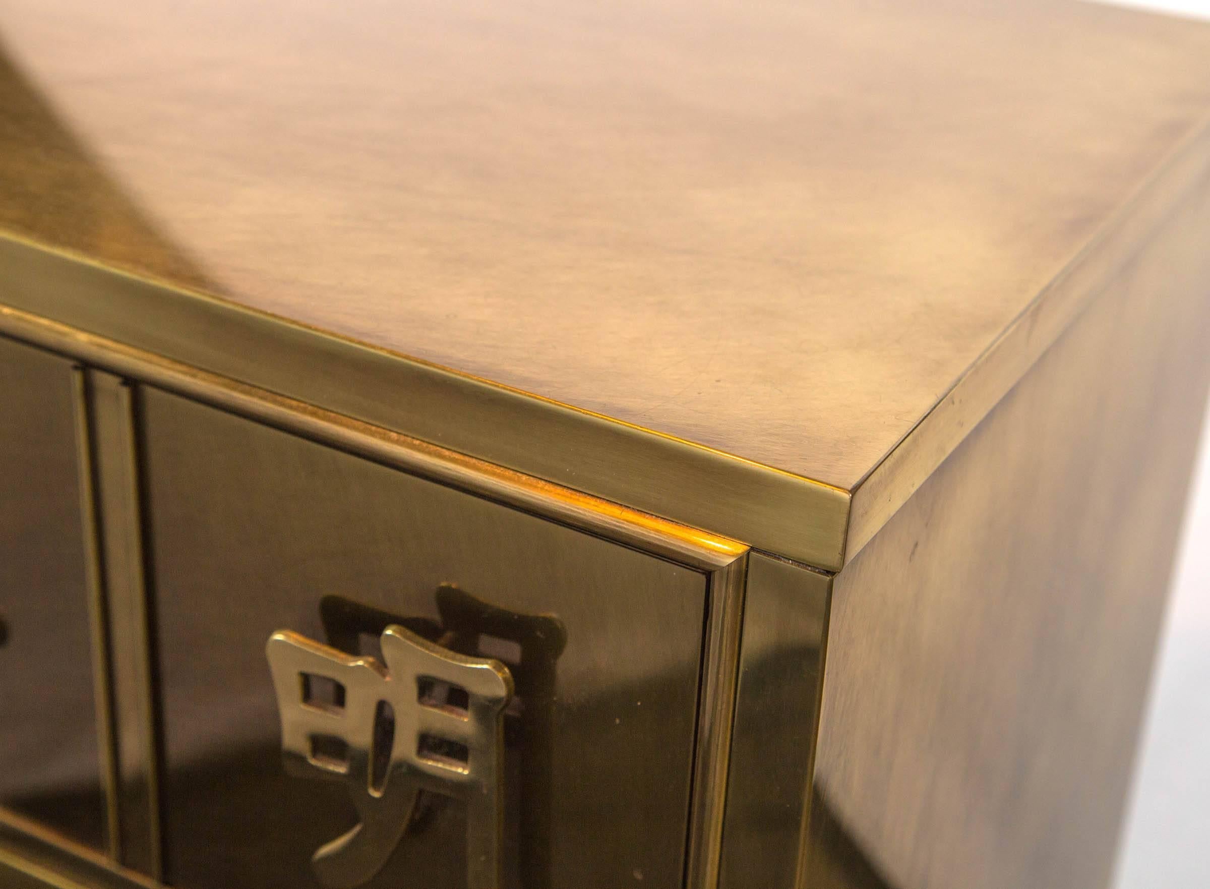 Stunning mastercraft brass three-drawer chest with solid brass Chinese characters as drawer pulls and decoration. One of the most superb designs from the illustrious Mastercraft Furniture Company.
Characters on chest: Chinese Dynasties: Ming, Tang,