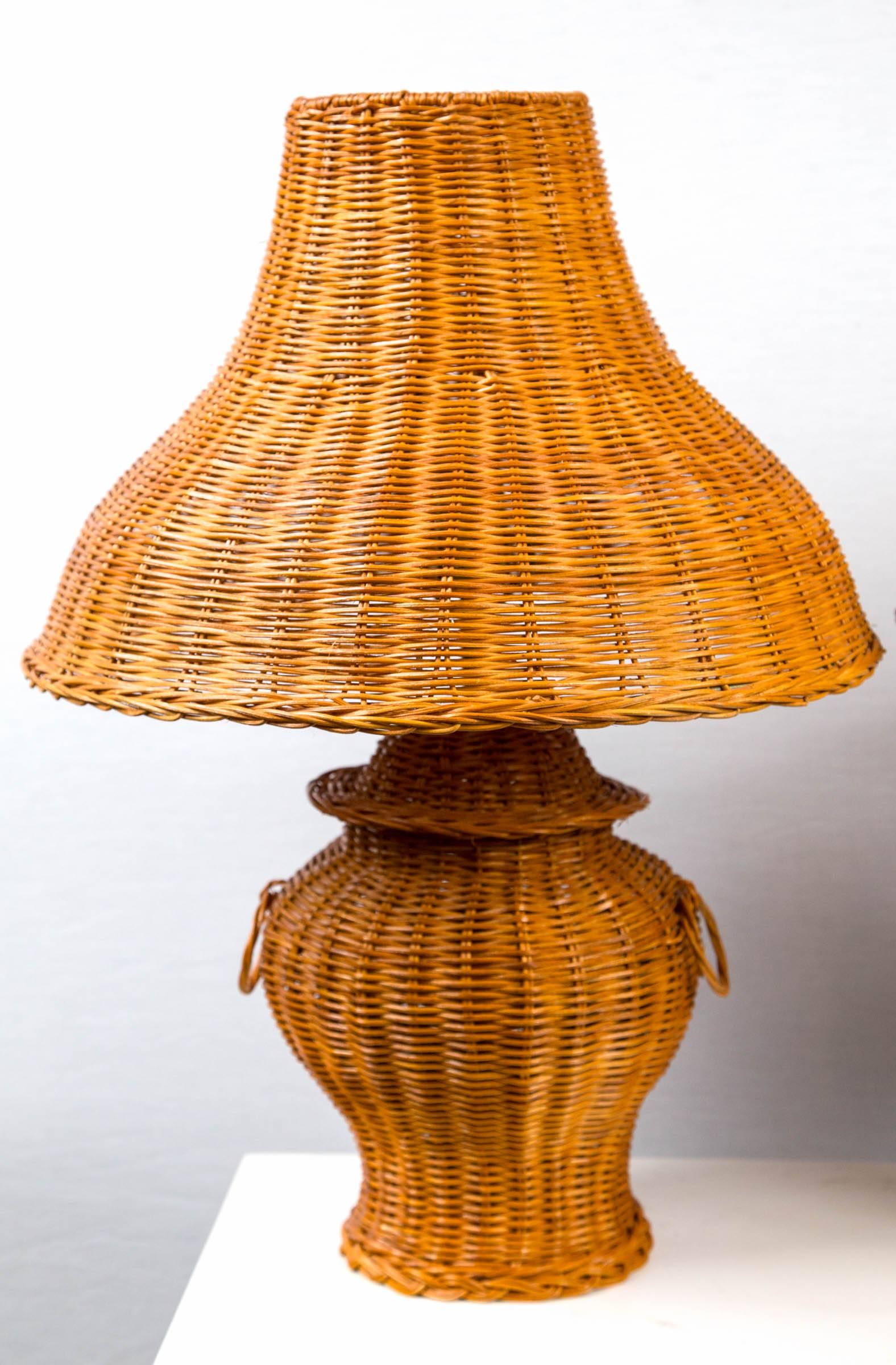 Ginger jar shaped wicker lamp pair with wicker lamp shades. Lamp base is 5.5 inches in diameter. One standard bulb per lamp.
 