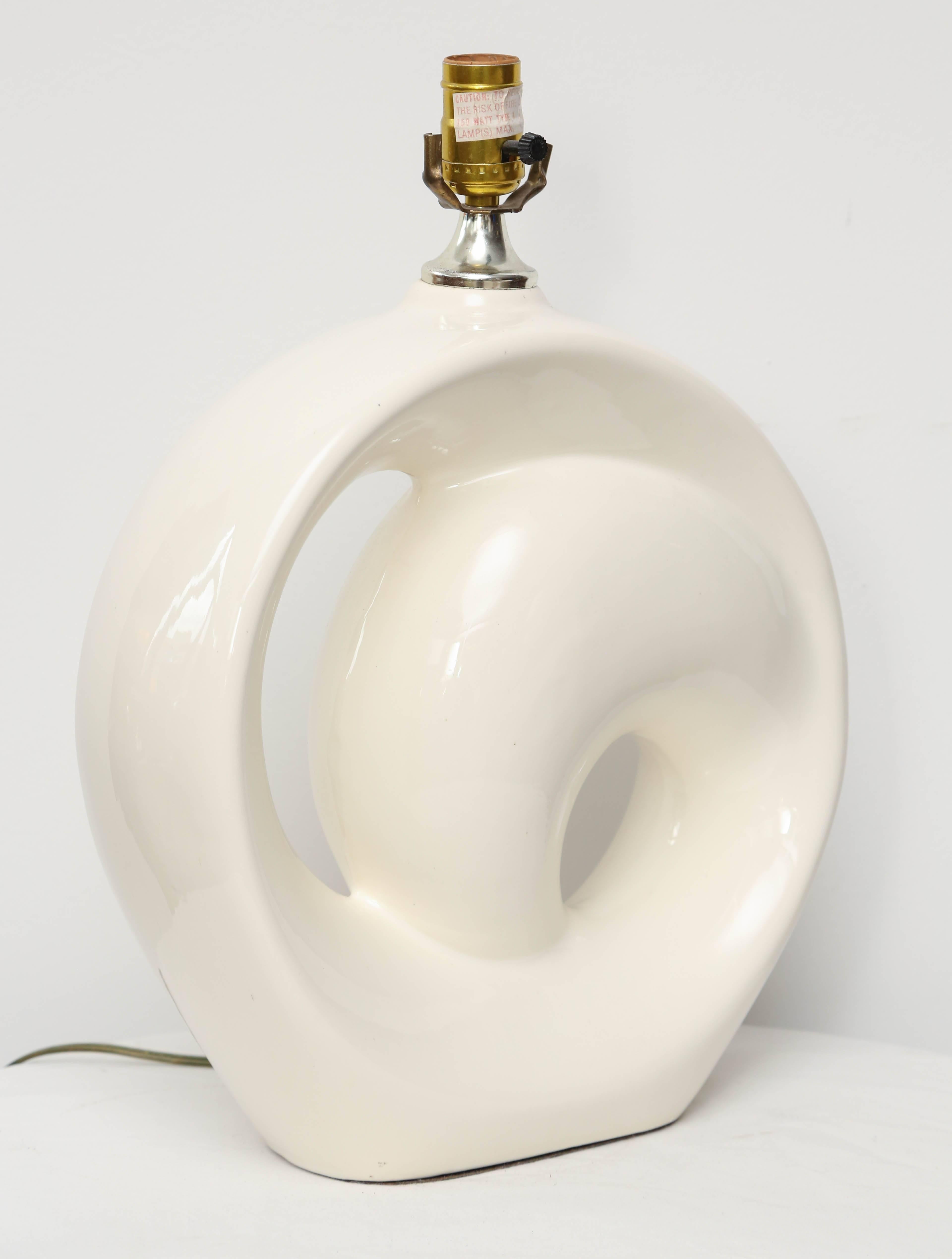 Wonderful single lamp in unique form in white ceramic.