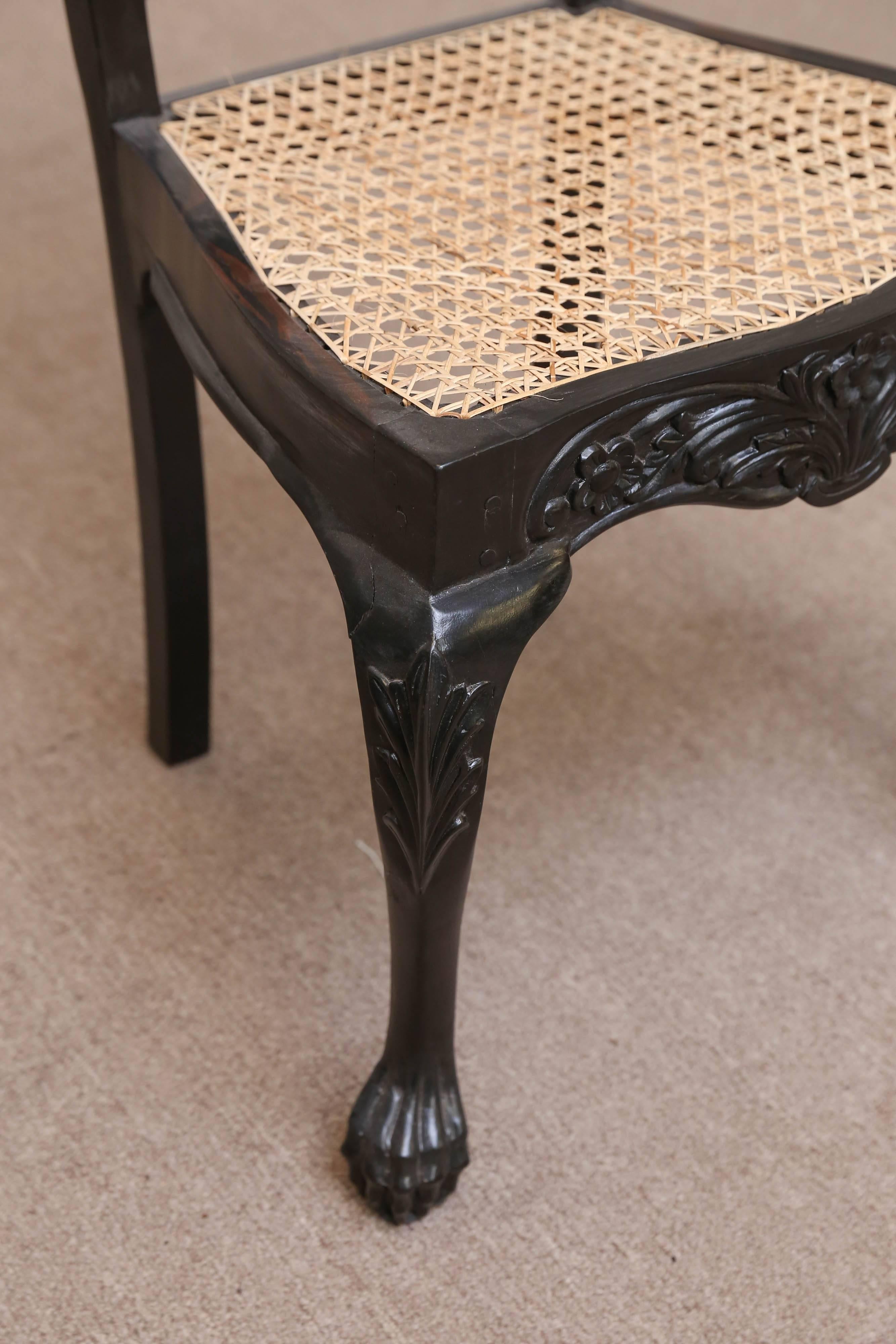Hand-Carved Four Mid-19th Century Exquisitely Carved Solid Ebony and Cane Side Chairs For Sale