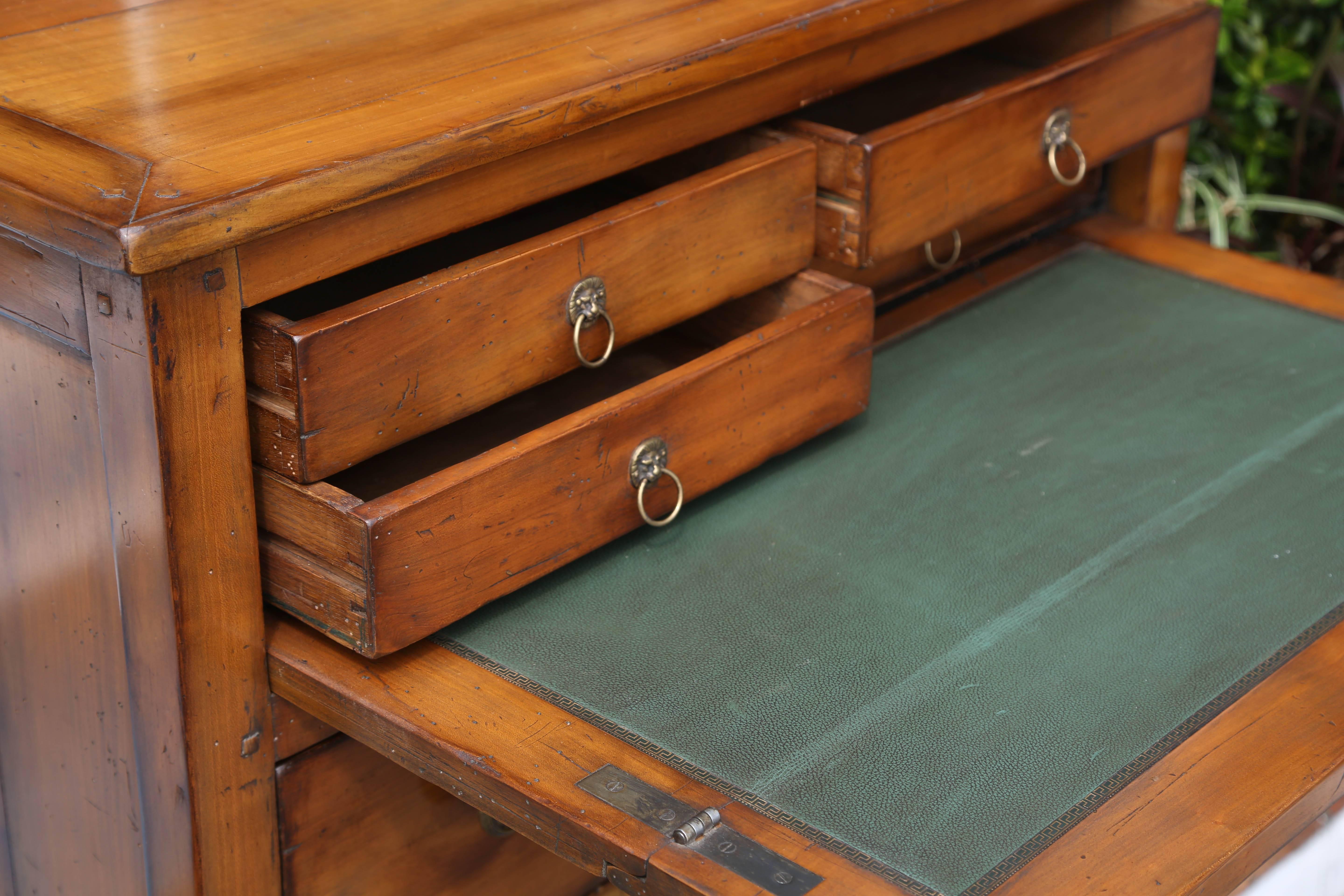 A nicely detailed vintage hand made cabinet fitted with a writing surface that pulls out from the top 