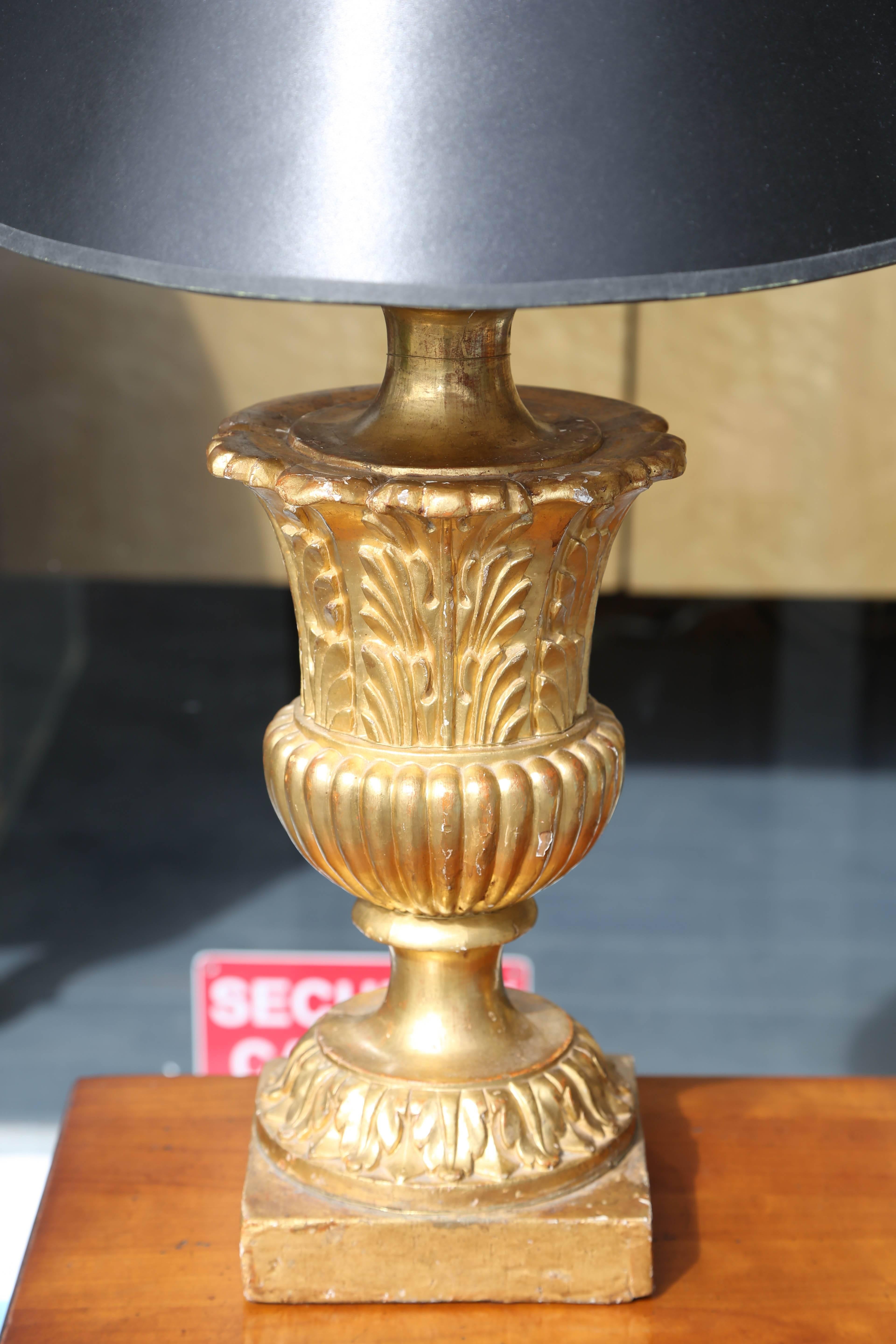 Original gilding (front facing). A fine pair of hand-carved giltwood urns.