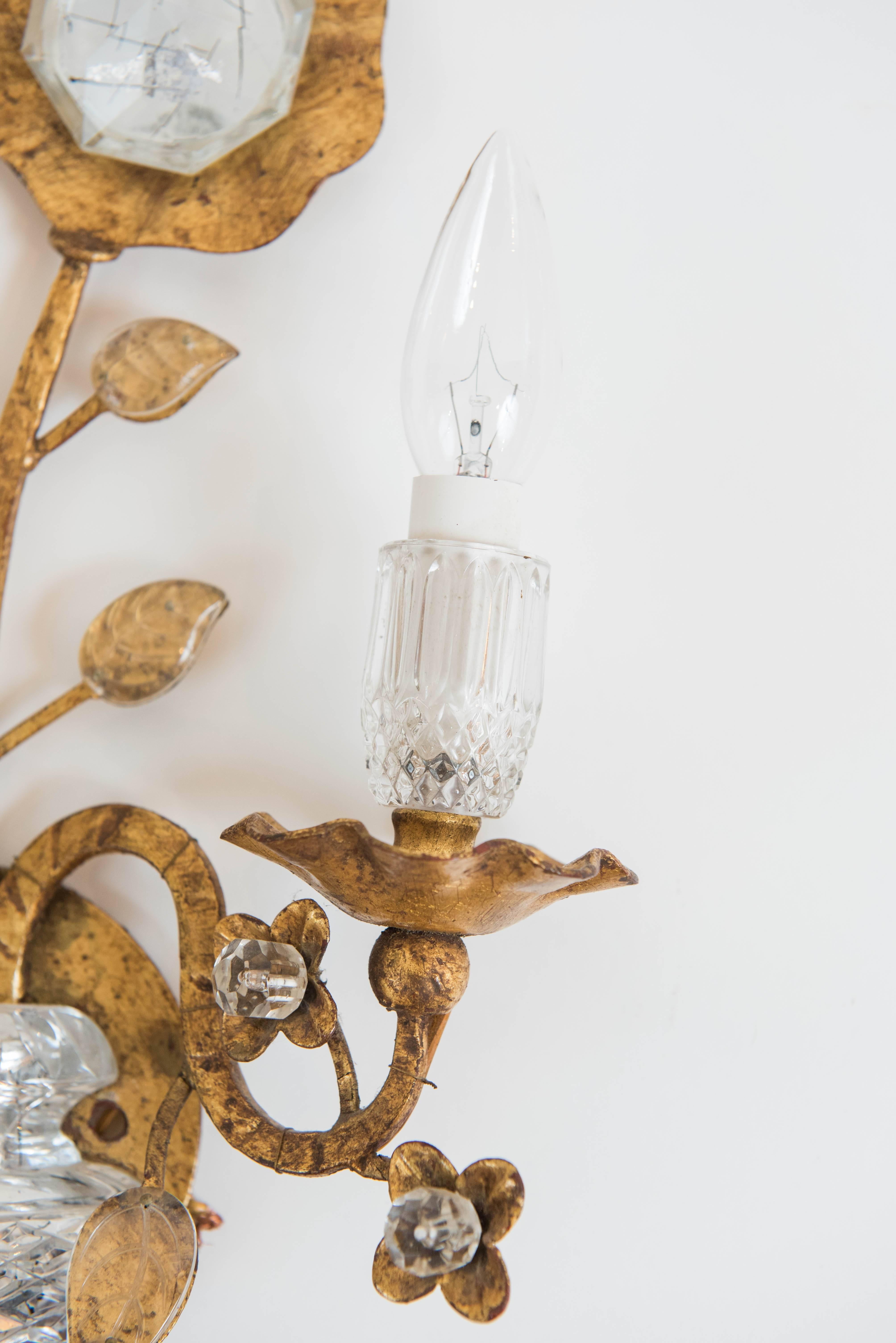 This beautiful and whimsical pair of gold leaf metal and crystal two-light sconce is in the shape of
a blooming flower and is wired for North America. They are produced in Italy by BF Arte!