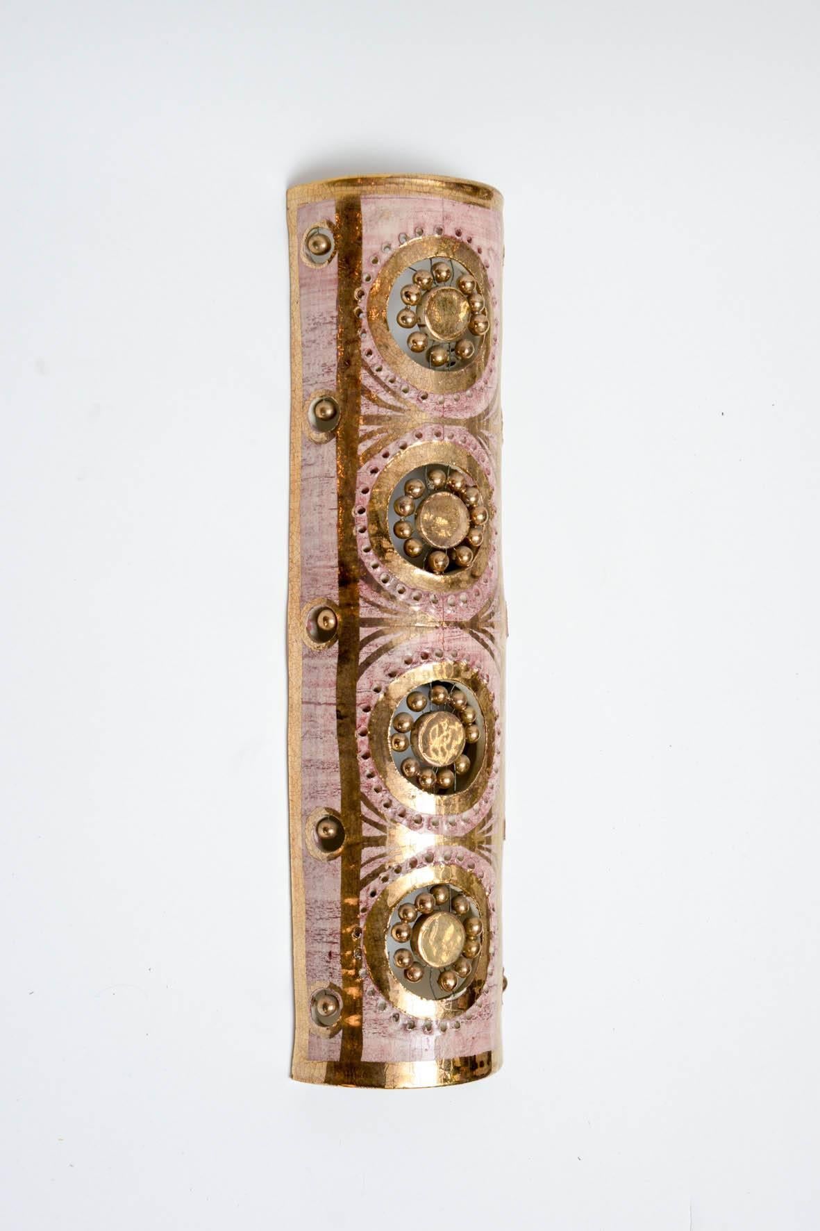 Pair of wall sconces by Georges Pelletier.

Made of pink and gold glaze ceramic in the pure style of the artist.