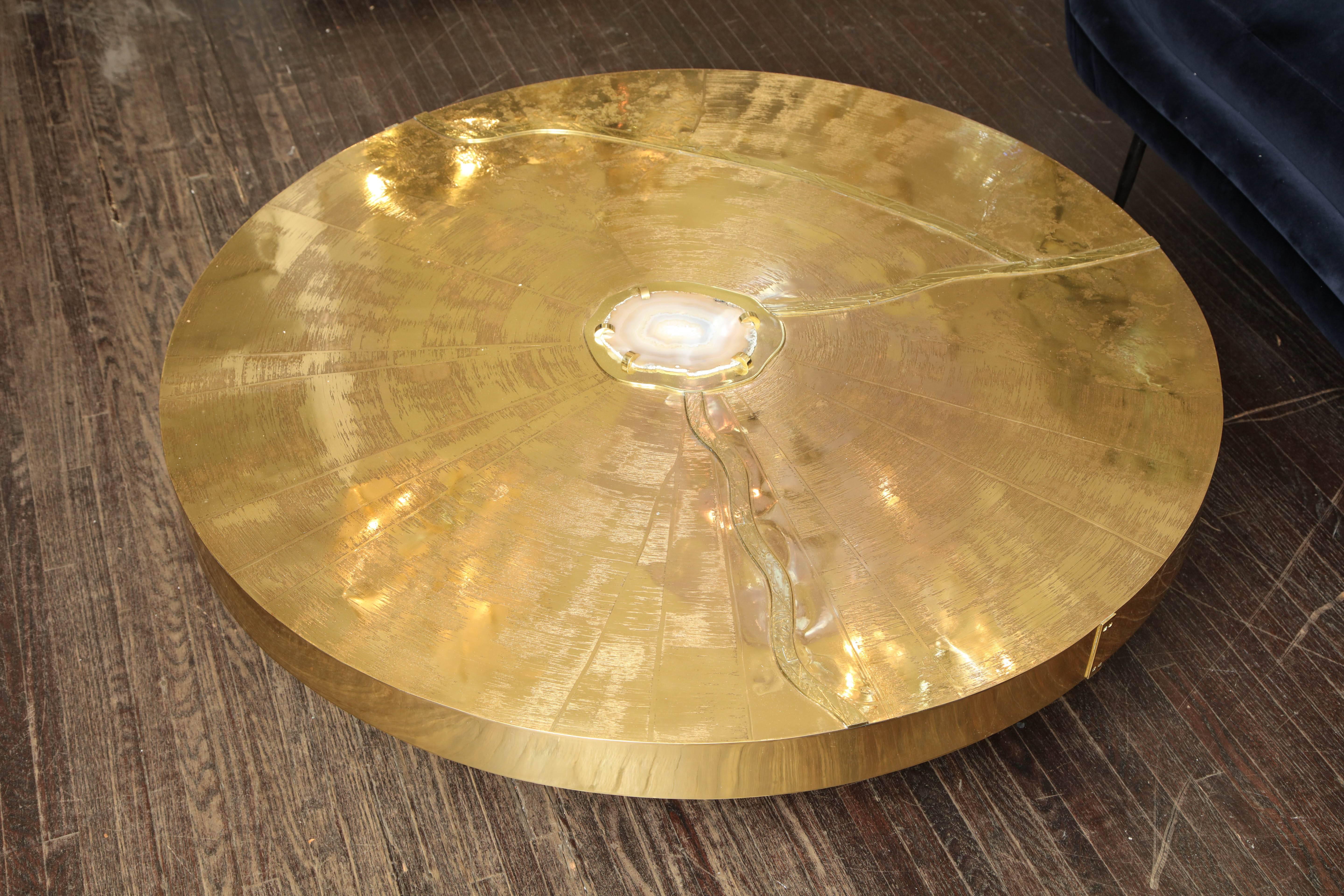 Spectacular round etched brass and agate cocktail table.