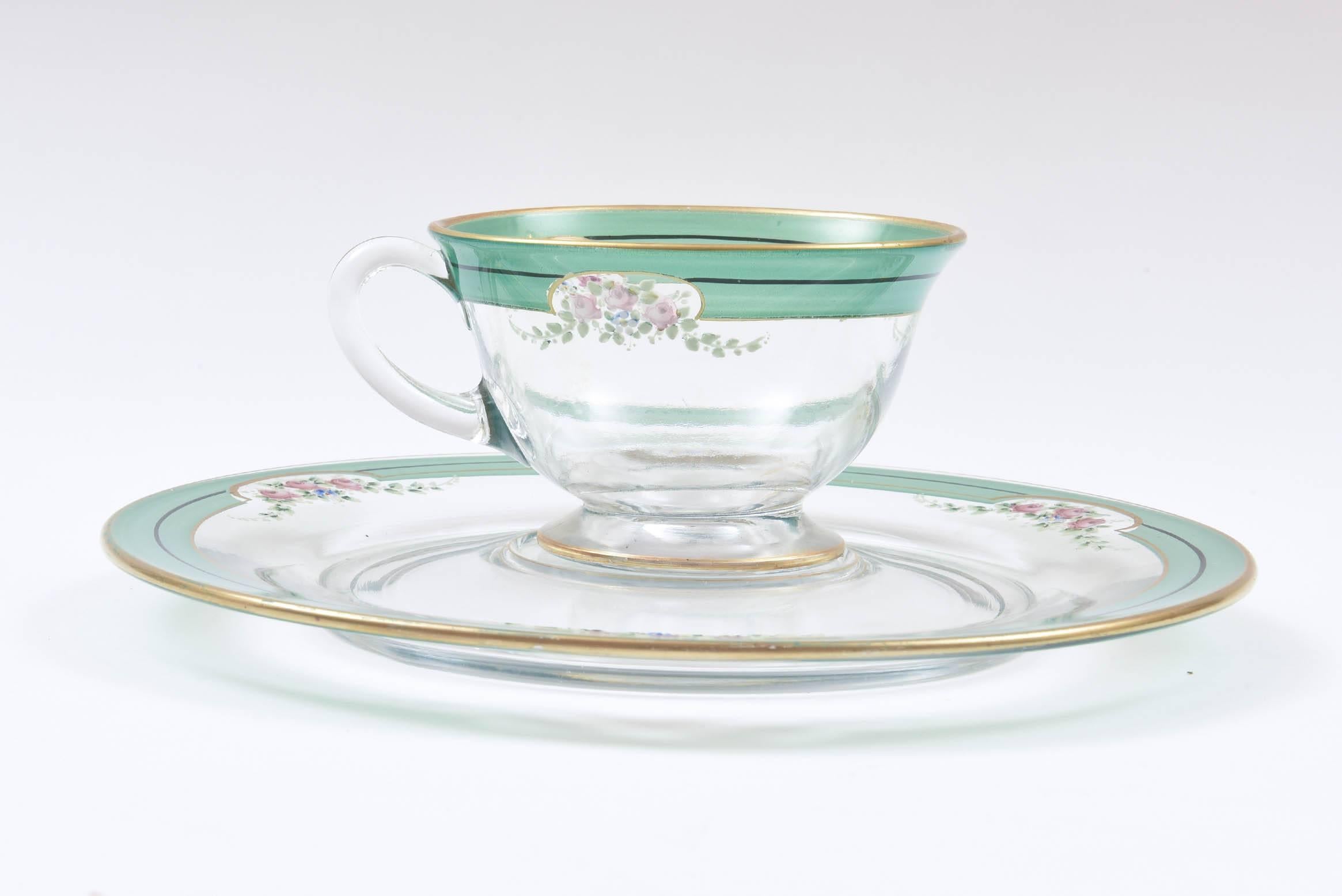 What a pretty and practical set of blown glass fitted dessert plates for their matching cups. Perfect for tea and toasts, desserts and tidbits. Trimmed in green with pastel pink floral sprays and gold trimmed. 24 pieces total: 12 plates and 12 cups.