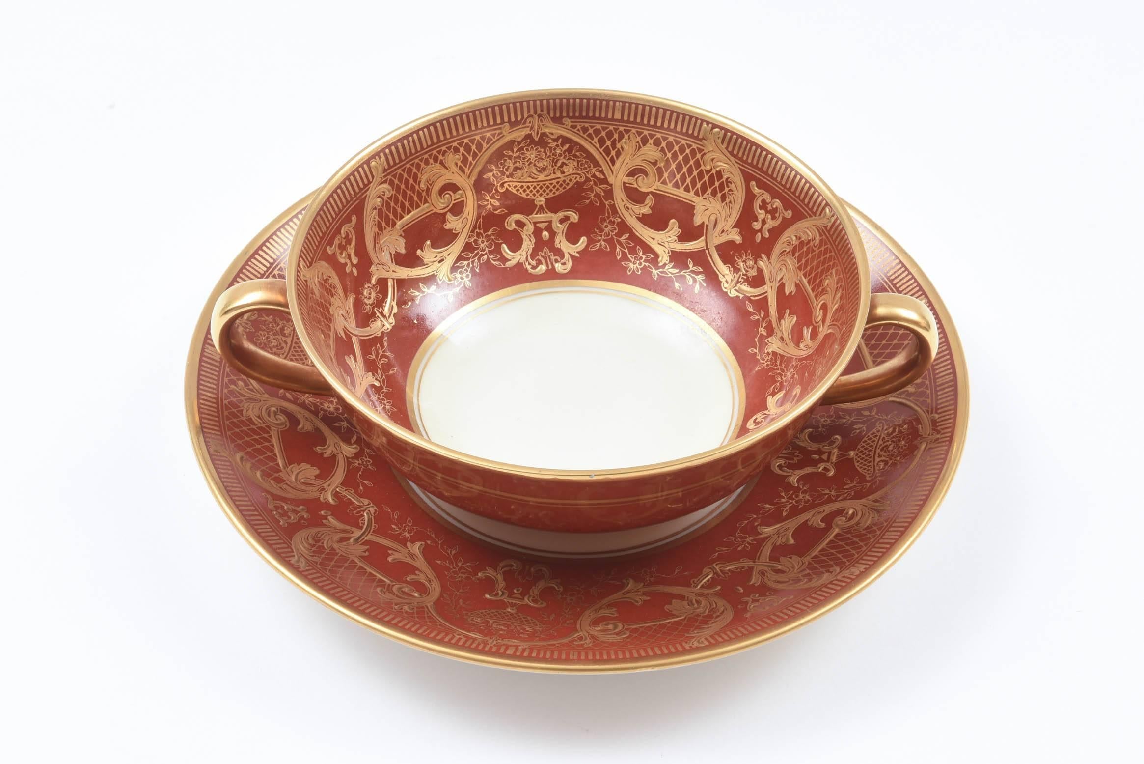 A great set of 12 matching soup or dessert cups and their 12 underplates ready for Holiday Entertaining. Raised tooled gilding on a dark orange ground. Custom ordered through the fine gilded age retailer Ovington Brothers New York. A very versatile
