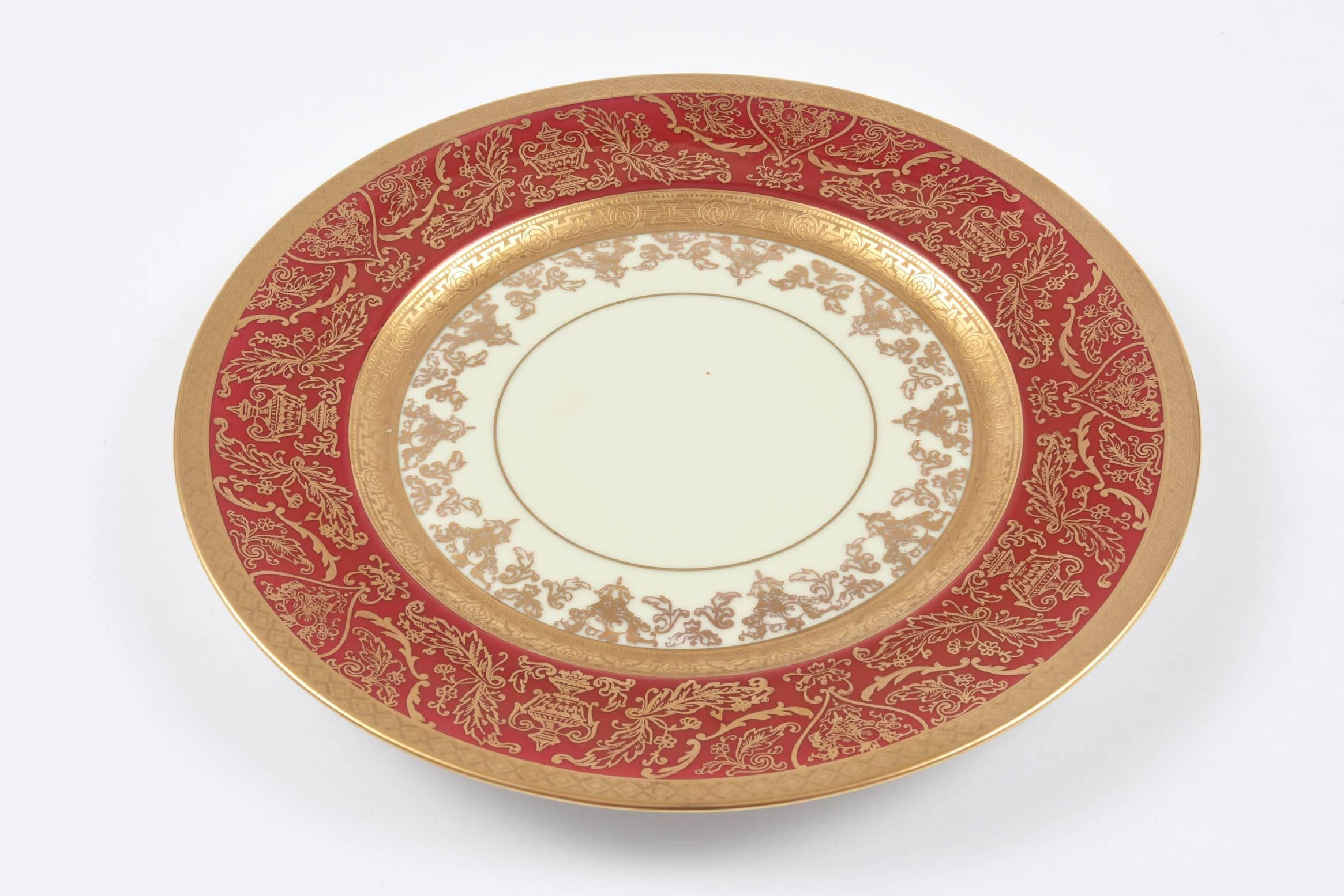 A great set of gilt decorated plates done by the American firm of Pickard who perfected the 24-karat acid etched gold technique in the 1920s. These plates are decorated by Pickard on a German produced blank by Heinrich & Co. Stunning gilt foliate