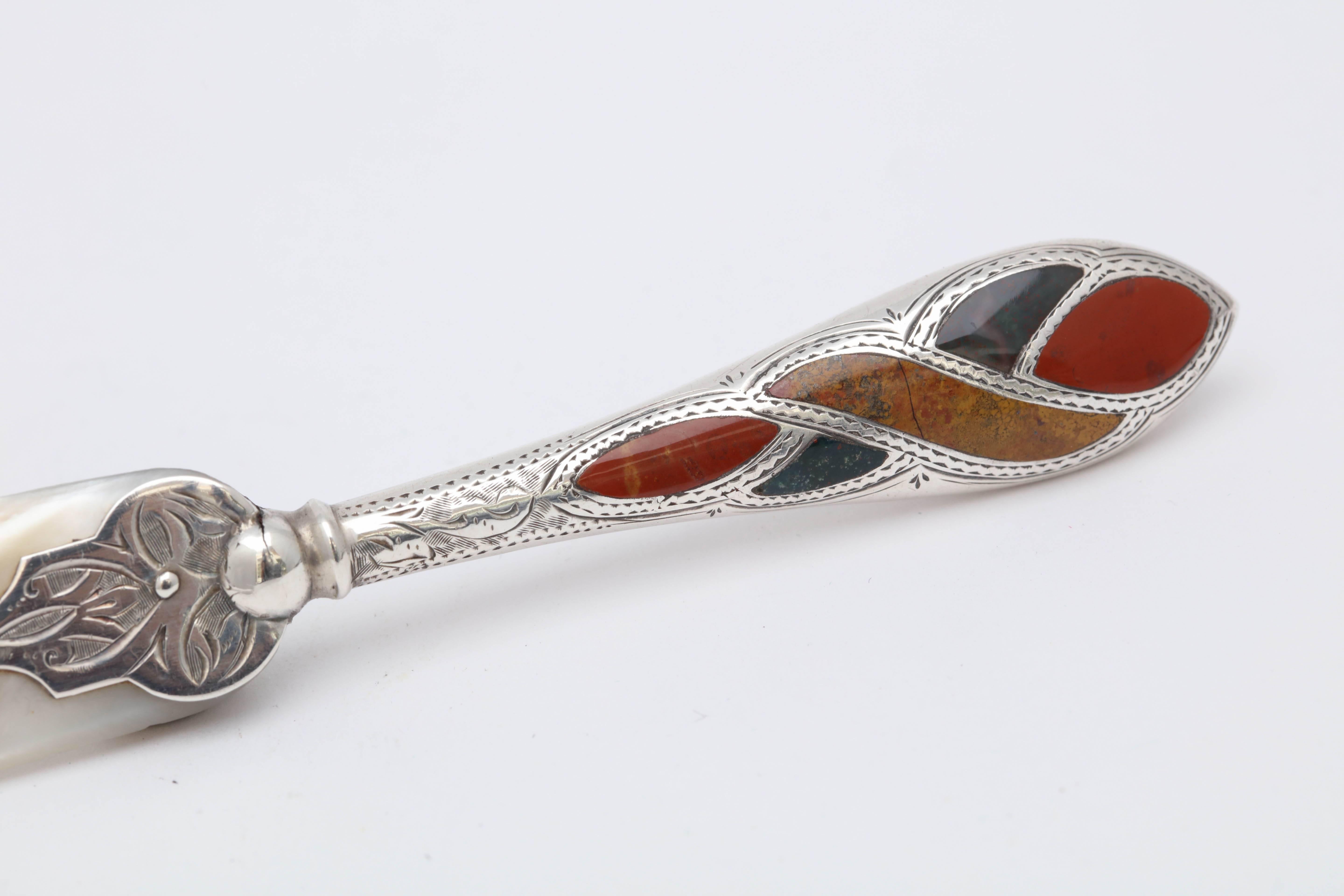 Rare, beautiful, Victorian, sterling silver and Scottish agate-mounted letter opener, Birmingham, England, 1895, Adie and Lovekin - makers. Lovely Celtic designs on silver. Measures: 7 inches long x 1 inch deep (at widest point) x 1/4 inch high.