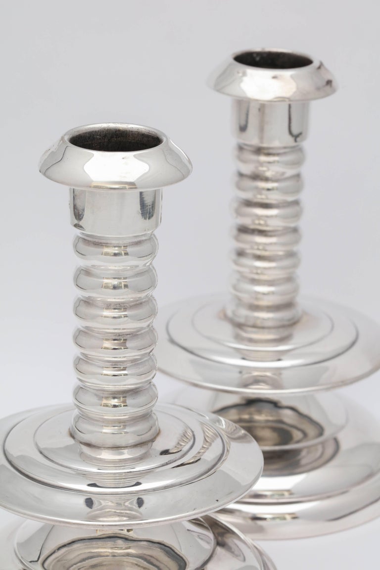 Unusual pair of sterling silver candlesticks in the 16th century Capstan style made to resemble candlesticks from the ship, The Mayflower, American, circa 1930s. Measures: 5 1/2 inches high x 3 3/4 inches diameter across base of each. Weighted. Dark