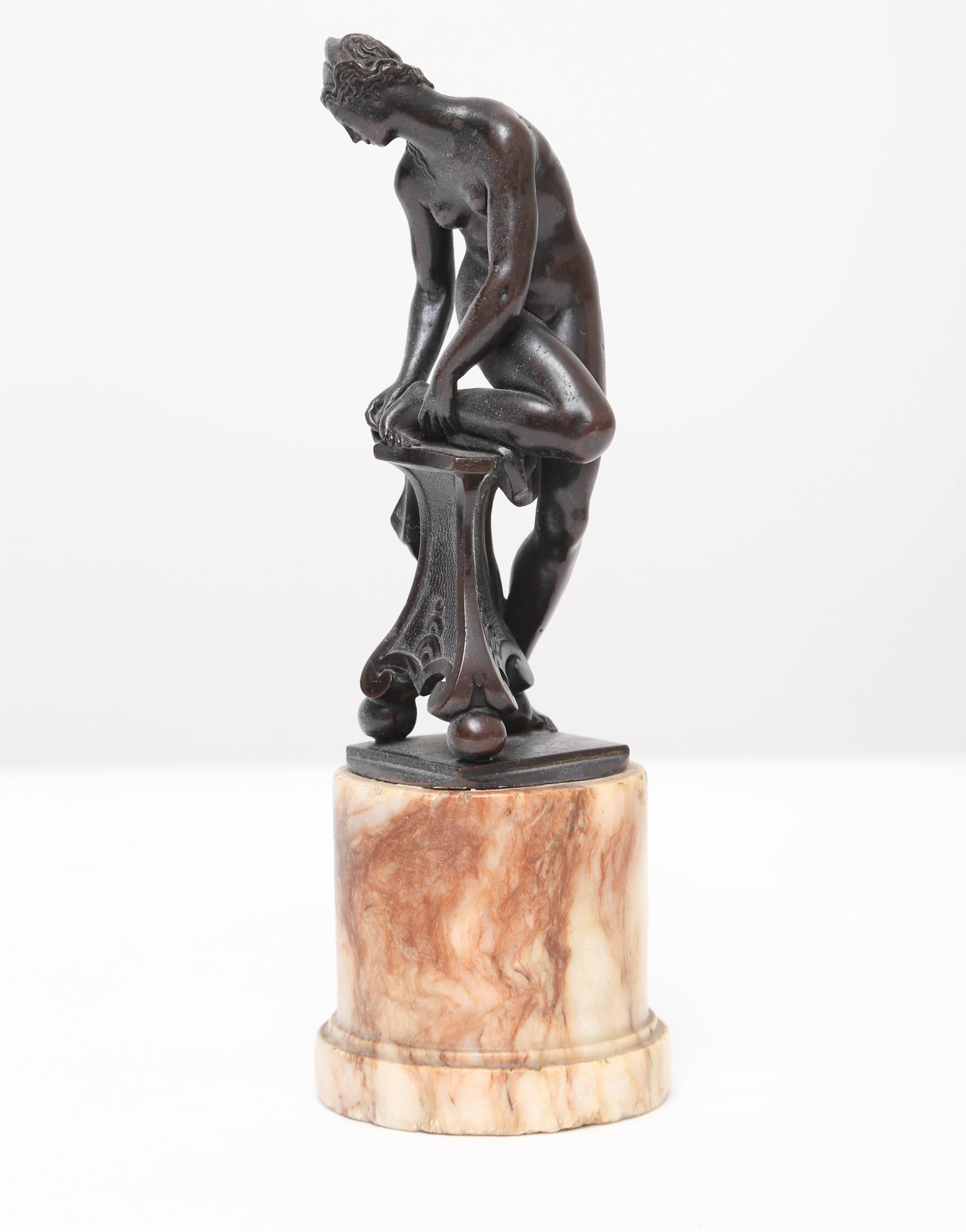 Although this bronze was cast after Giambologna (1527-1608), this model of Venus removing a throne from her foot as it rests on a tripod pedestal is very rare with few known examples. In their 1978 Giambologna exhibition catalogue Charles Avery and