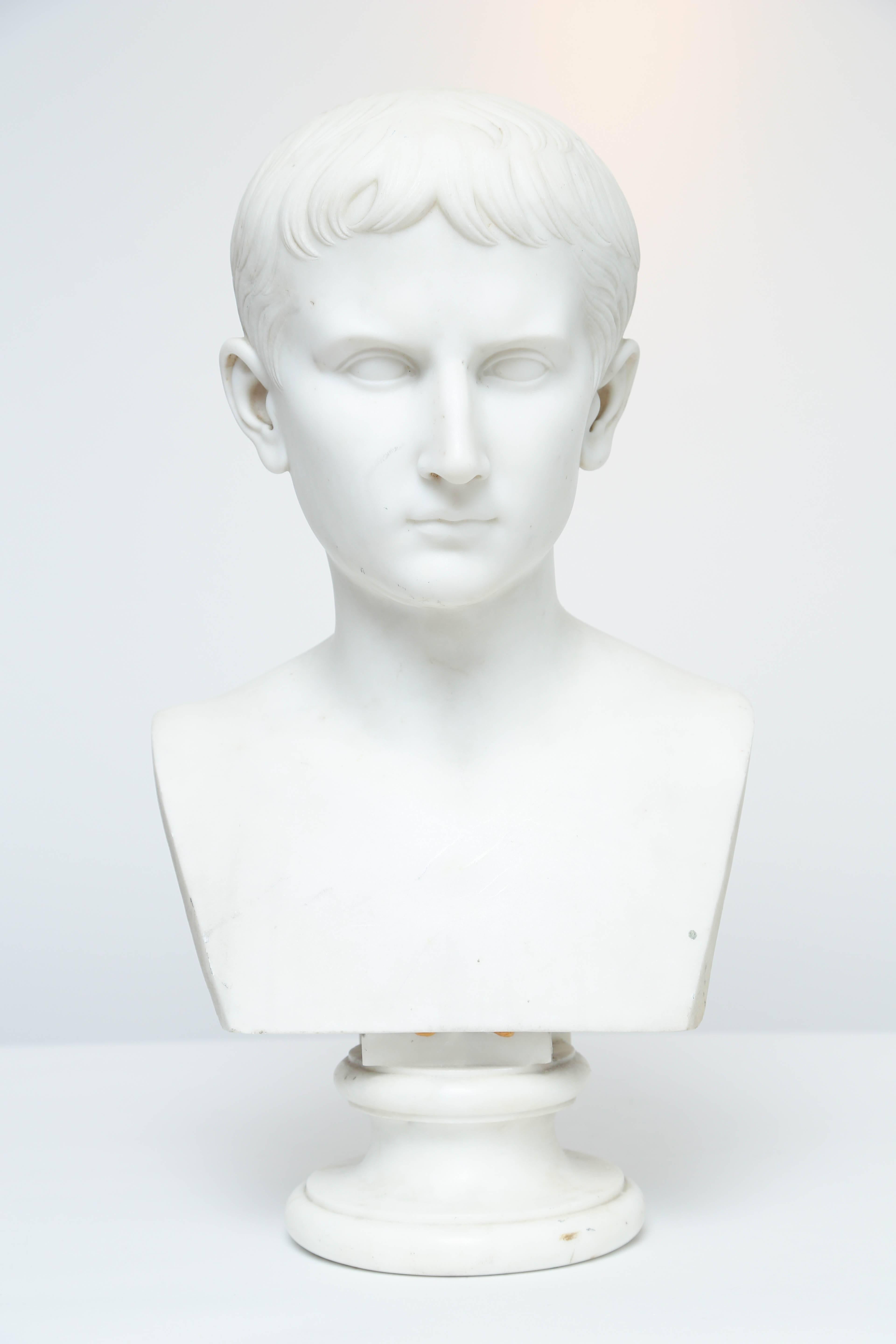 19th century portrait bust of Augustus Caesar, heir to Julius Caesar, depicted as a boy while he was named Octavian before becoming emperor in 27 BC. He was 19 at the time of the murder of Julius Caesar and was part of the Second Triumvirate which