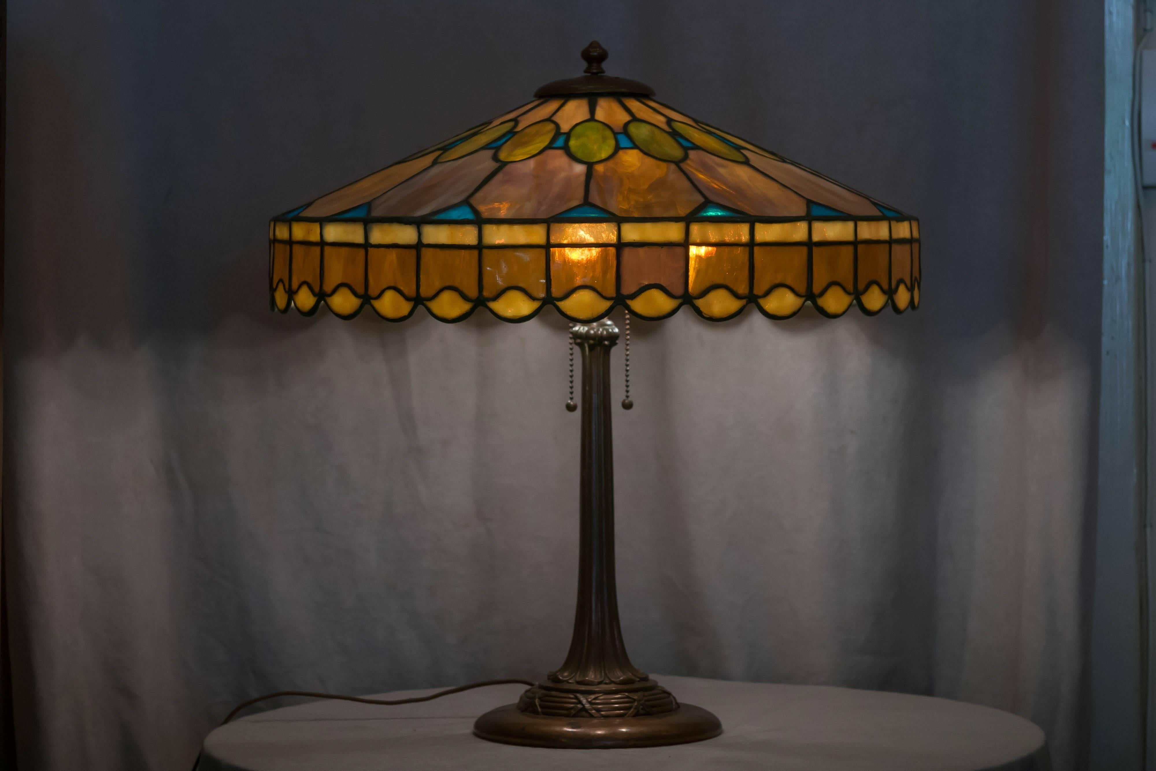 Duffner & Kimberly was Tiffany Studios chief competition at the turn of the century, that is to say from the 19th to the 20th century. They made some of the finest leaded glass lamps of that great period when many companies were in competition. Many