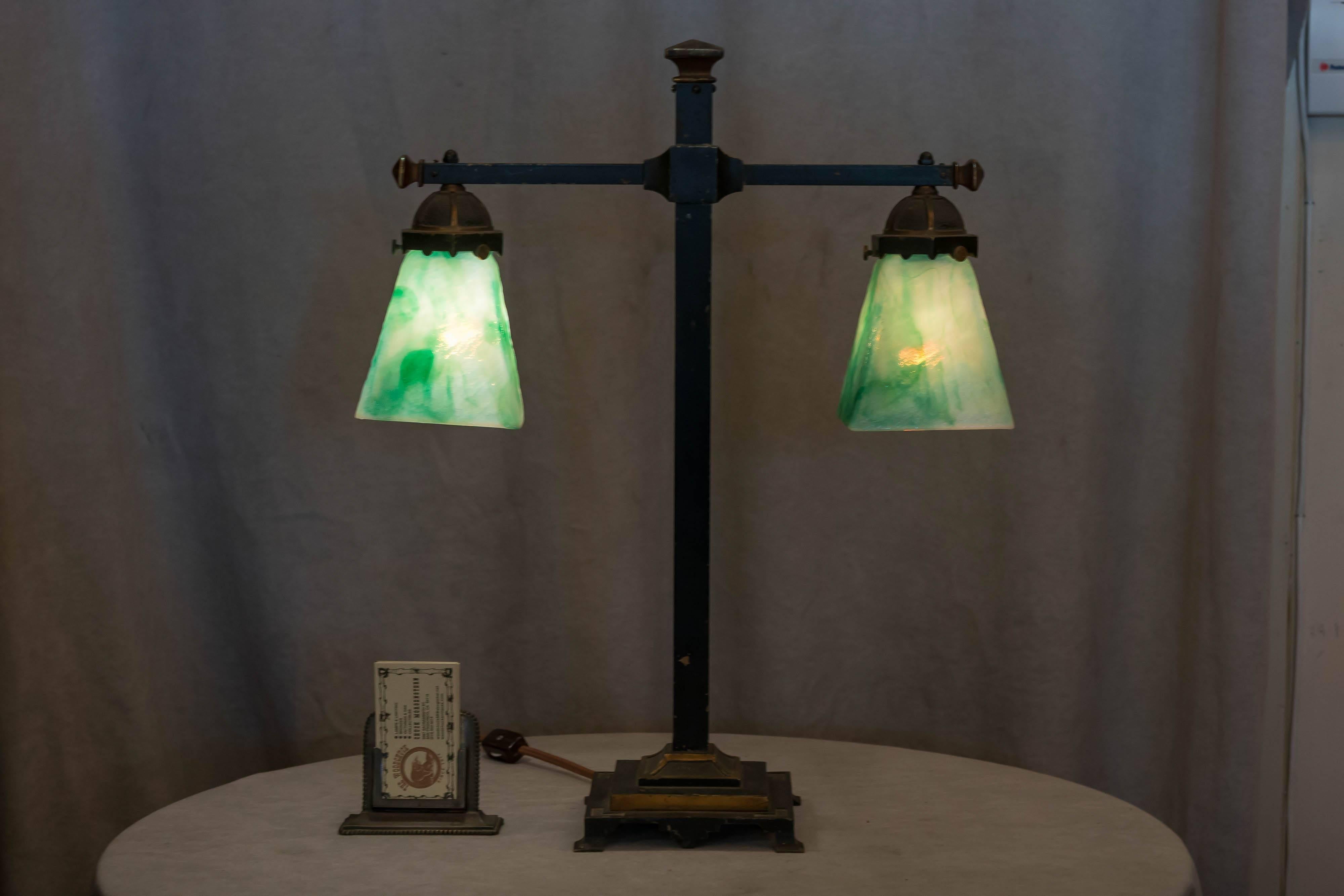 This easy on the eyes table lamp is a rare little gem, possibly done by the Bradley & Hubbard Co. The shades are perfectly matched for this lamp and were done by a little known company out of Canada , 
