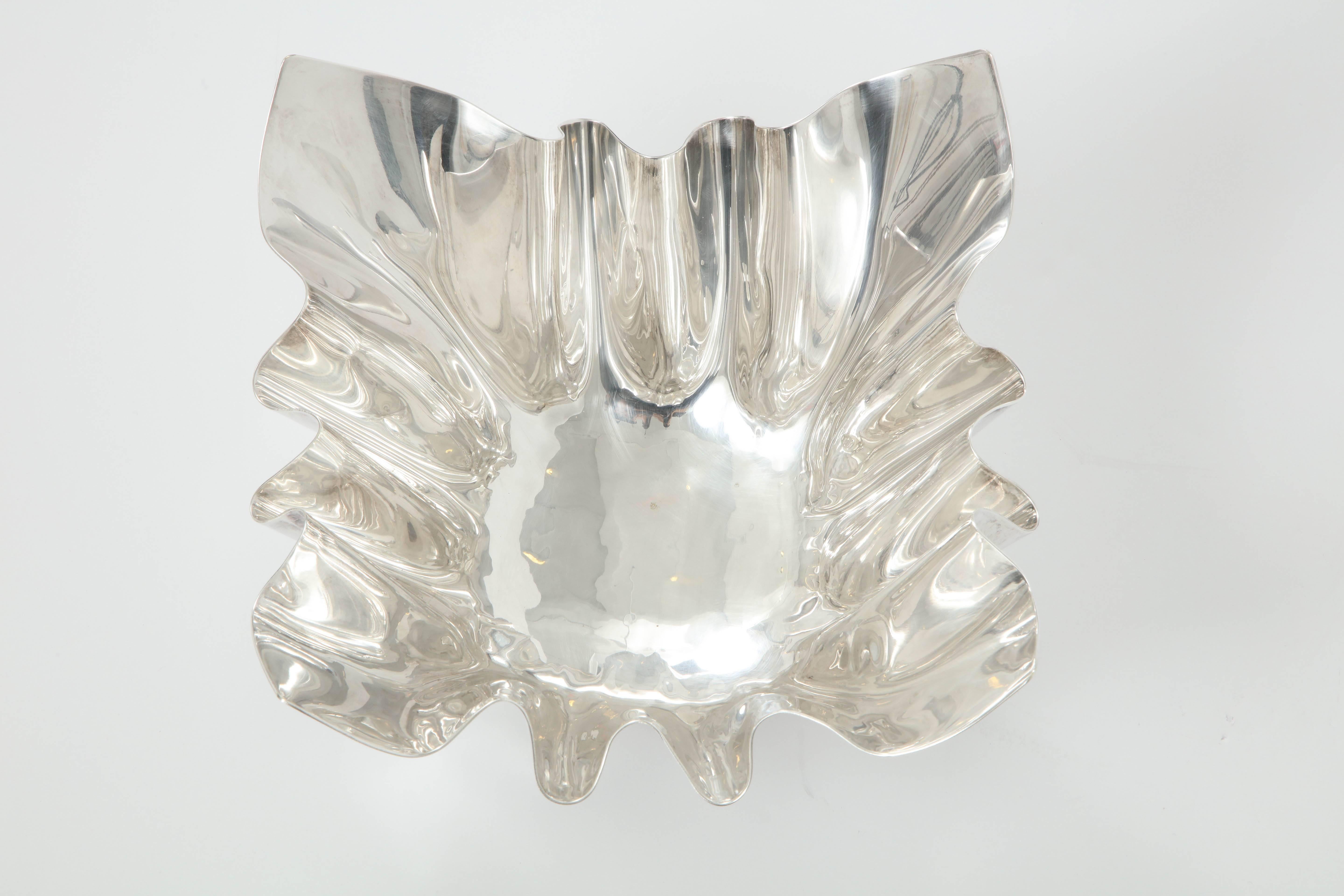 Beautiful Italian silver plate handkerchief serving bowl with three bun feet, perfect for candy or snacks. Beautiful design and signed, Made in Italy with a feel of Sabattini.