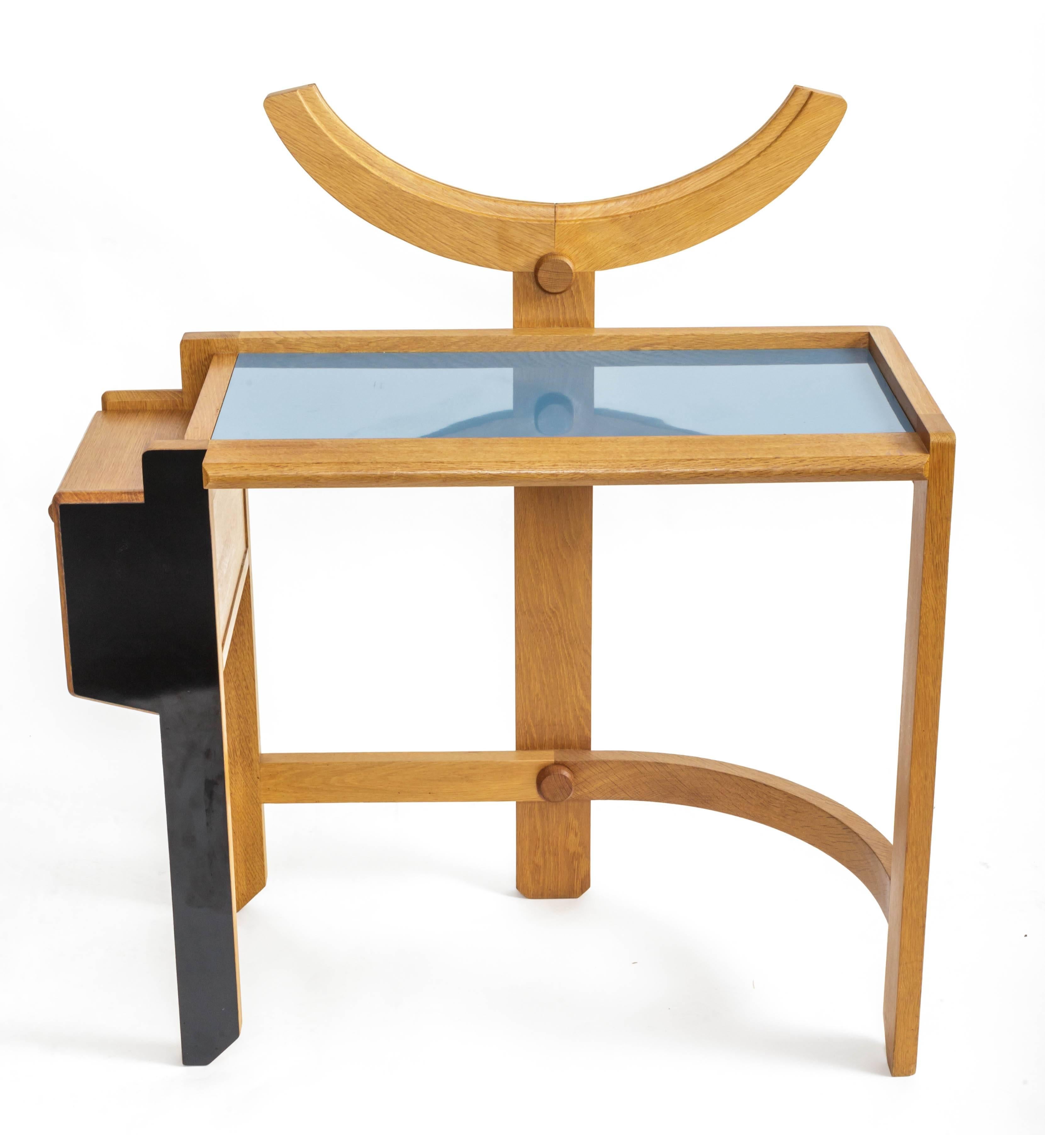 Oak vanity table with blue top
By Guillerme et Chambron
France, 1950s

Table is intended to hold a curved piece of mirror.
 