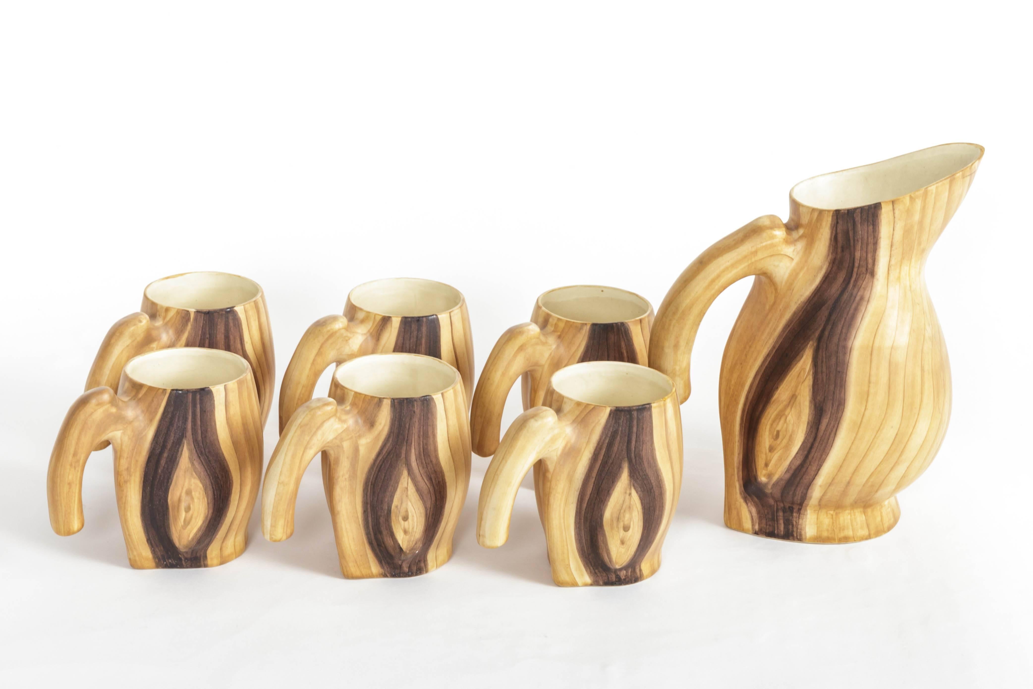 Faux bois ceramic set by Grandjean Jourdan, includes a pitcher and six mugs, France, 20th century.