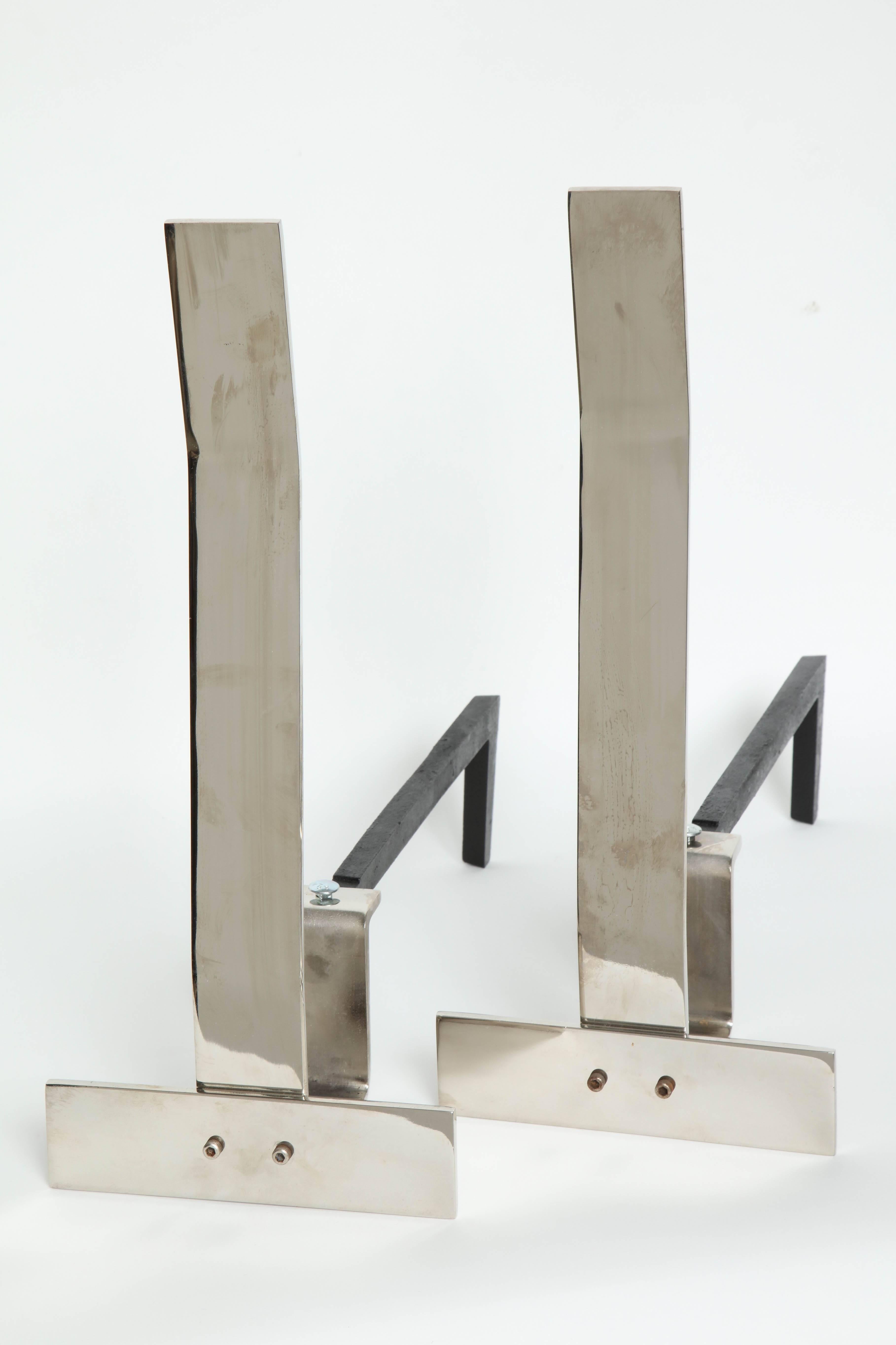 Pair of modernist polished nickel inverted ‘T’ andirons with blackened iron backs by Alessandro.