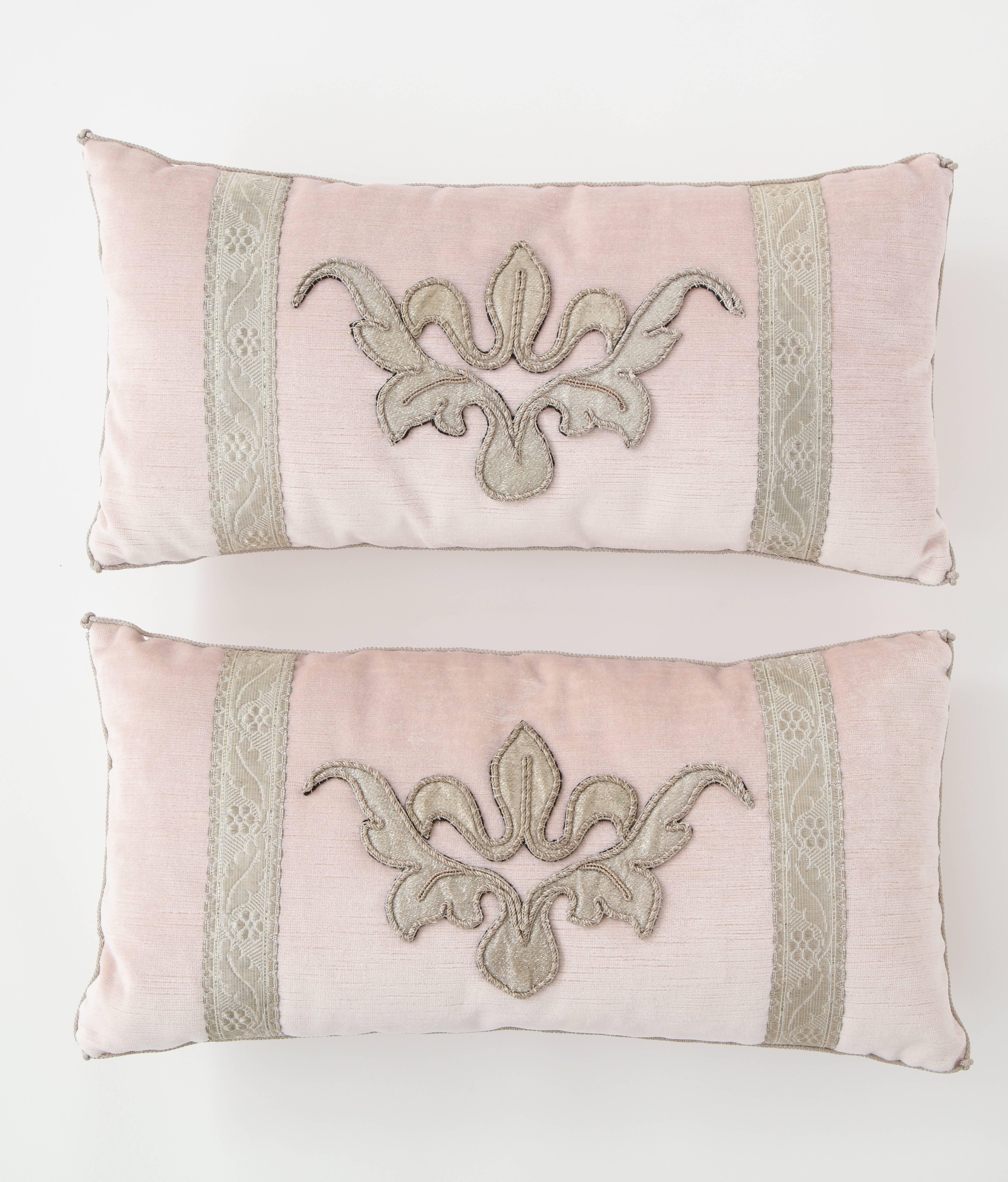 These beautiful pillows were designed by BViz Design and we are delighted to offer them in our shop. Crafted with antique metallic fragments, the pillows feature a fleur-de-lis design in the centre bordered by antique trim on either side. They are