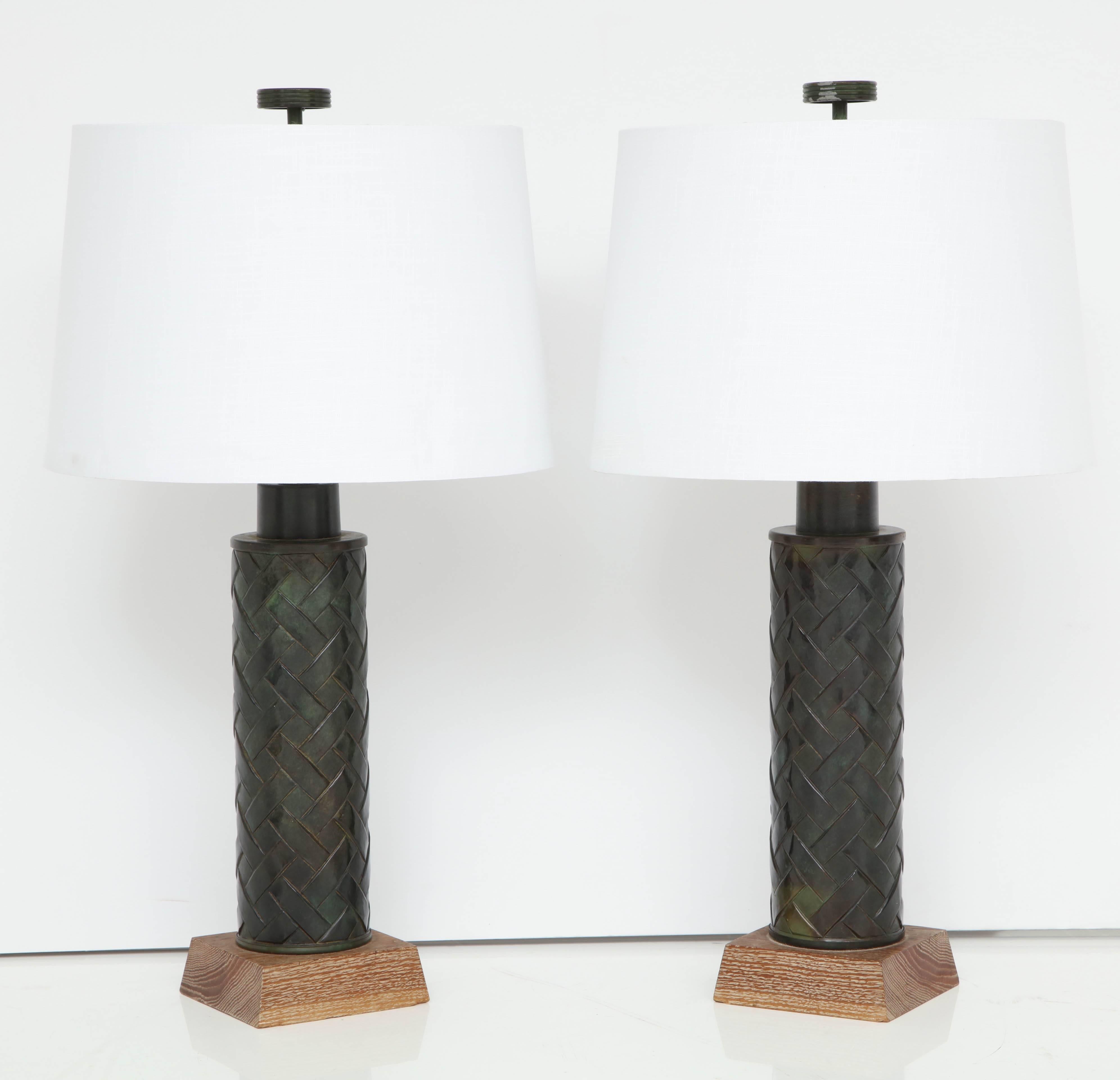 Fantastic pair of bronze lamps on oak bases, of note is the pattern on the bronze bases that reminds of the 