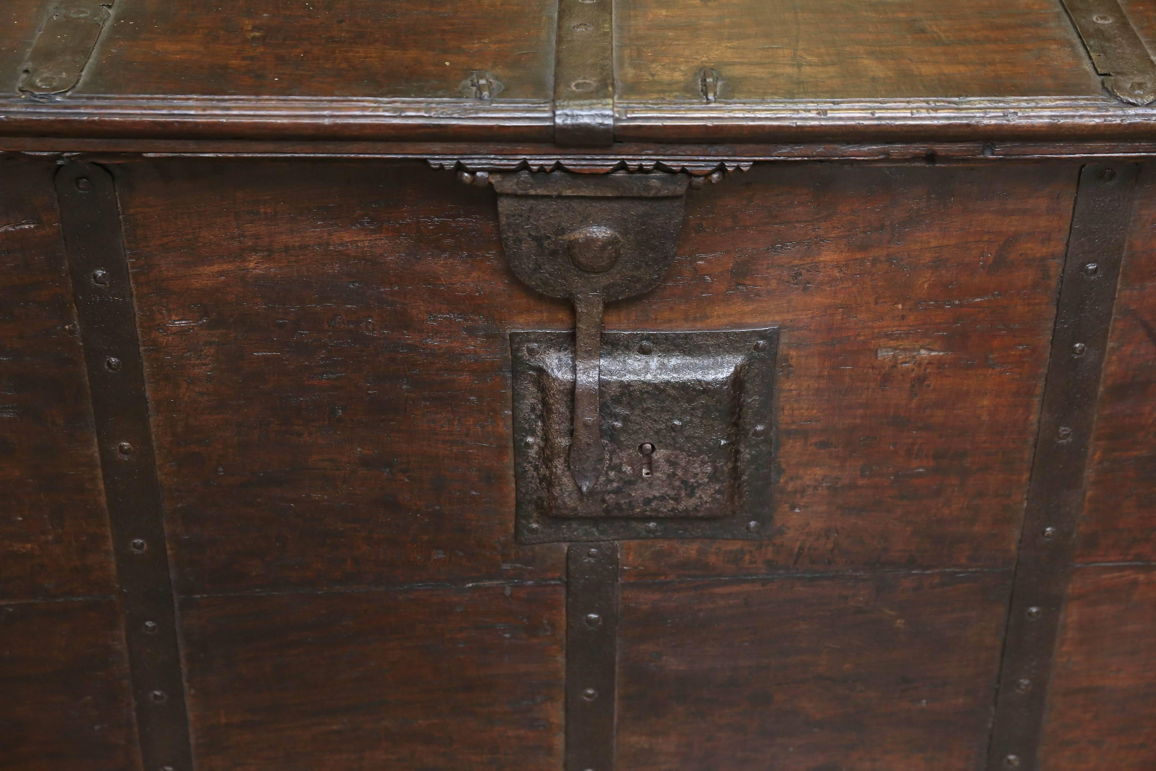 This is a quintessential example of old world carpentry. Made in the early 19th century it has all the features of great cabinetry such as dovetail joints, reinforced by hand forged iron bars and use of red hot nails to fasten the iron bars to the