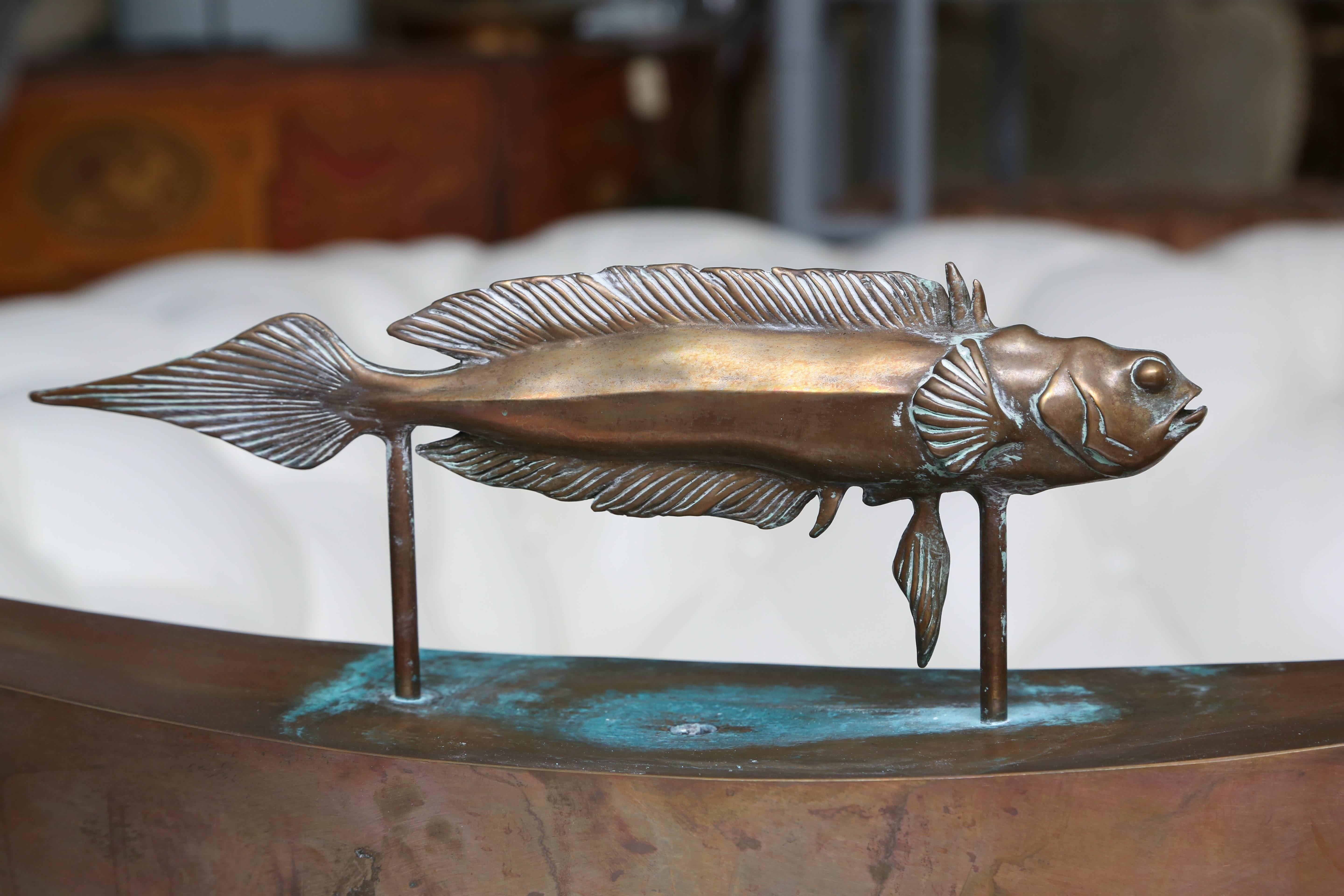 Excellent detailed figure of a fish - unusual form. A rather unique tabletop variety.
The "arc" fits into the heavy base which holds the water.