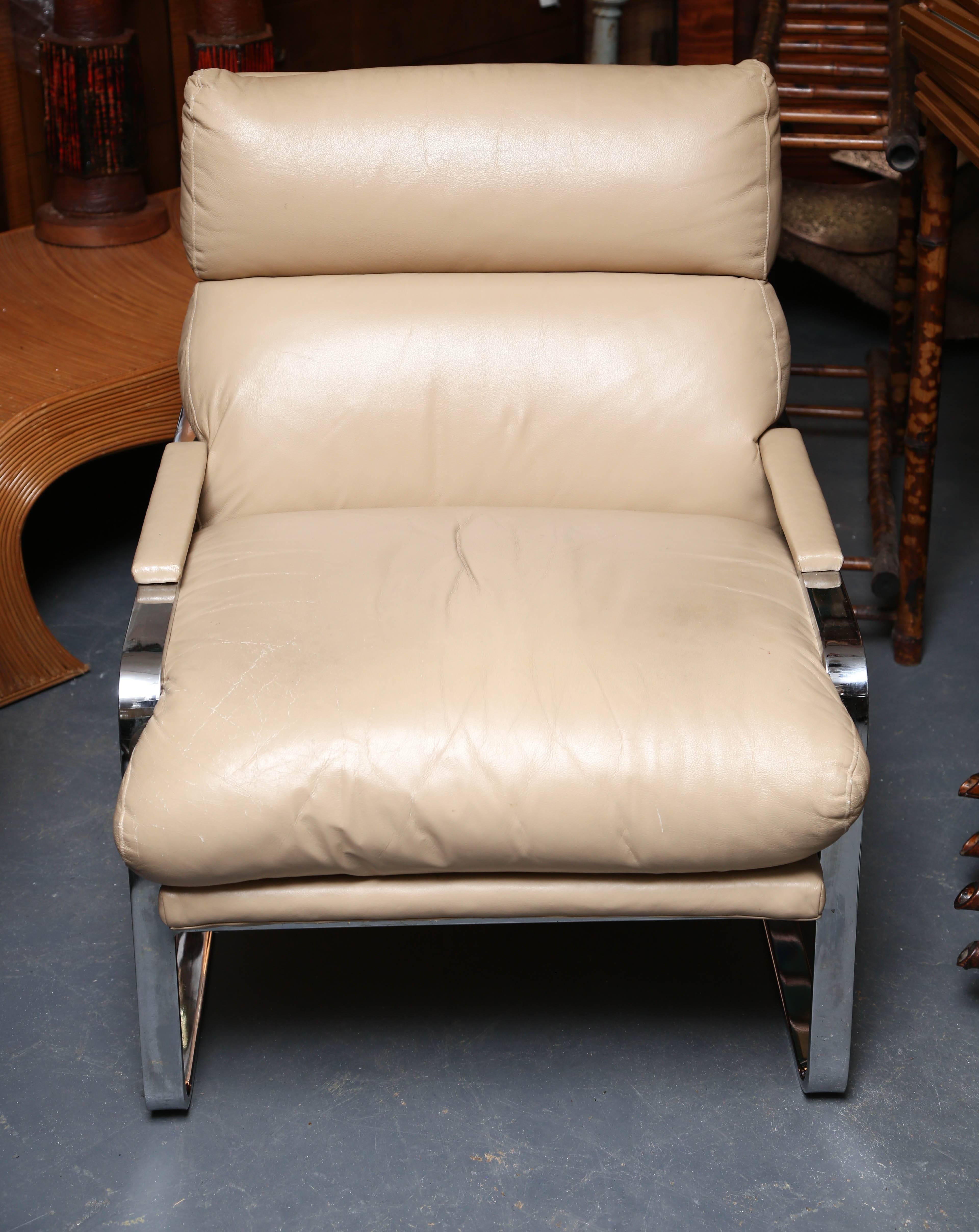 Plush creamy leather upholstery over a sleek chrome frame.